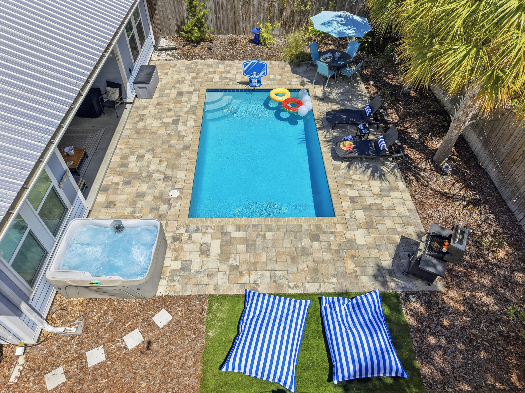 Relax on the pool deck with your favorite beverage, and watch friends and family play the day away in the pool with floats, basketball, masks and more, or simply hang in the hot tub and soak for the evening.