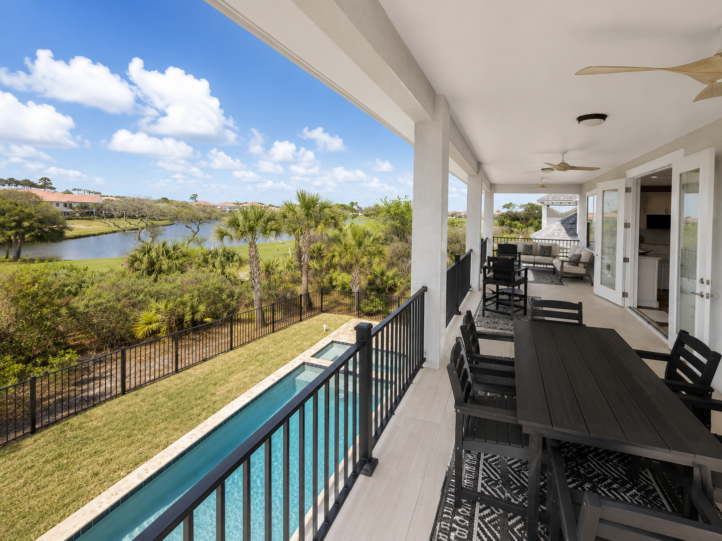 Imagine long dinners out here as the sun sets over the fairway—plates full, glasses raised, nobody in a hurry to leave. This breezy covered balcony, with room to dine and to lounge, becomes the setting for your family's favorite evenings all week.