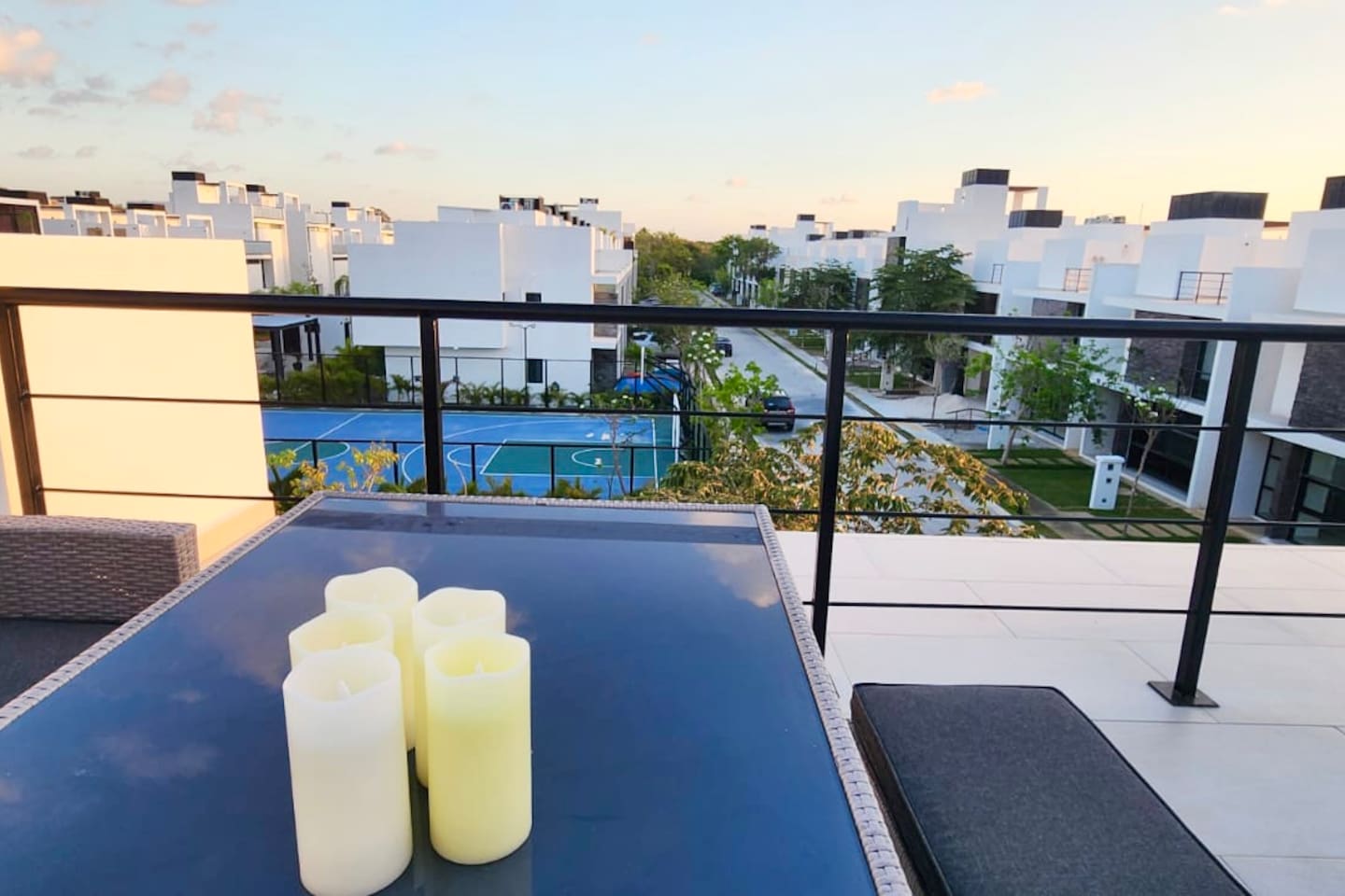 Rooftop terrace facing 2 pools and basketball court, playground area, outdoor entertainment dining area w. Bbq, and gym. 