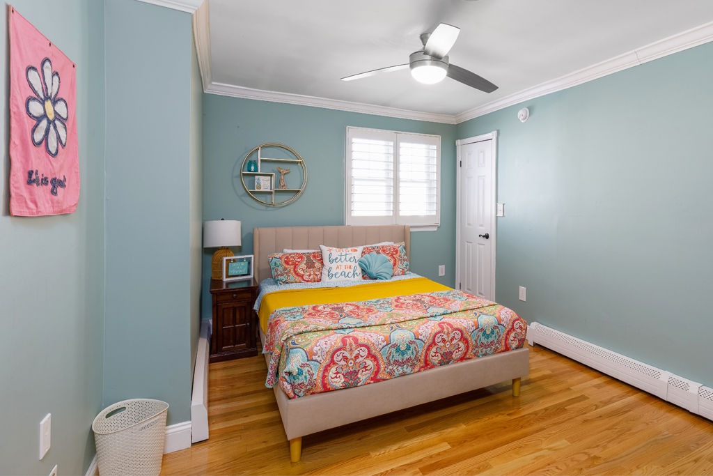 Enjoy this cozy third bedroom on the second floor with a smart TV and walk in closet.