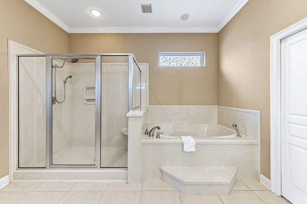 Walk-in glass shower and separate soaking tub
