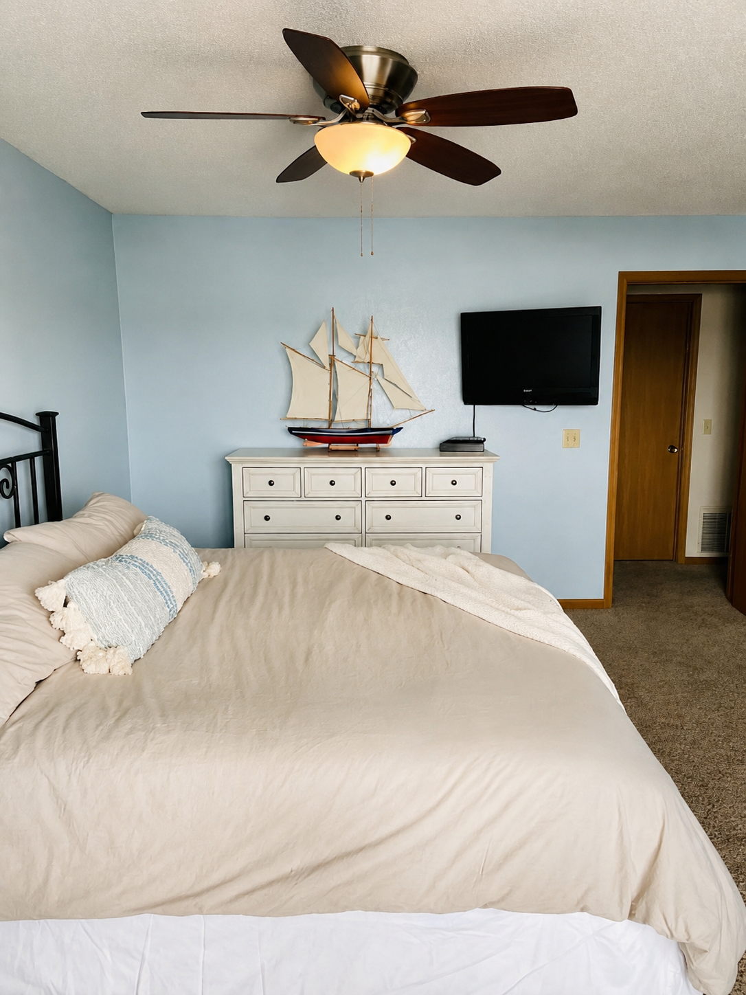 Bedroom with wall-mounted television