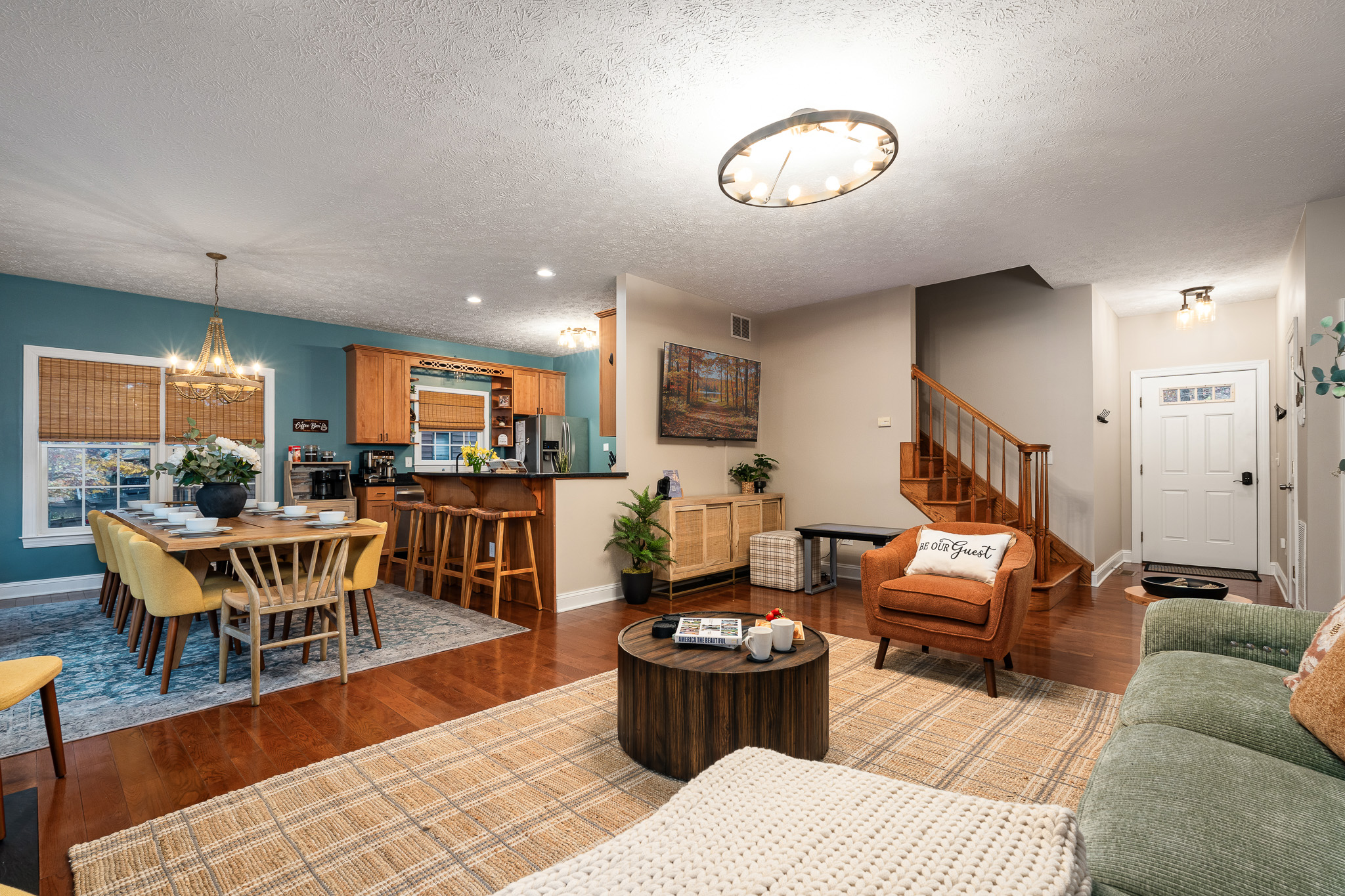 A spacious living room made for gathering — comfy seating, soft lighting, and room for everyone to relax.