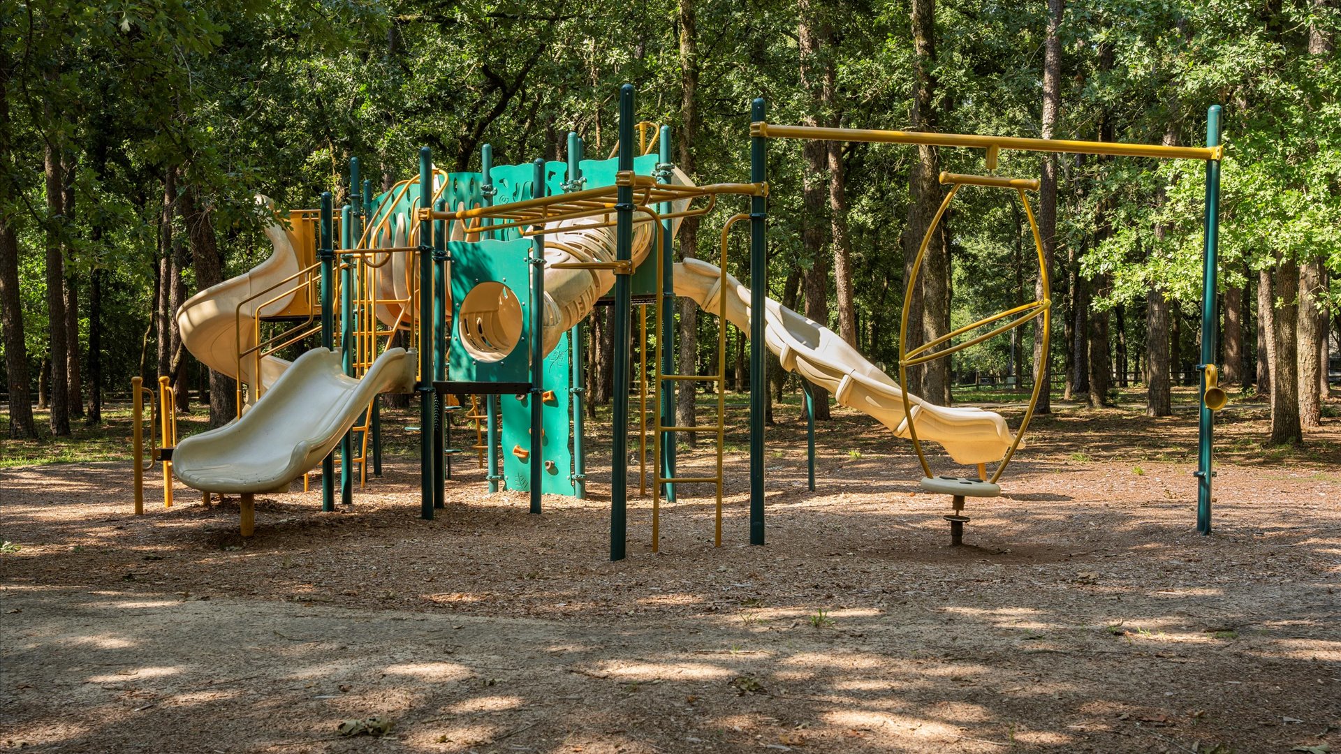 A fantastic playground just a block from home, surrounded by towering trees for shade. Featuring multiple slides, climbing structures, and interactive elements, it’s perfect for kids to play.
