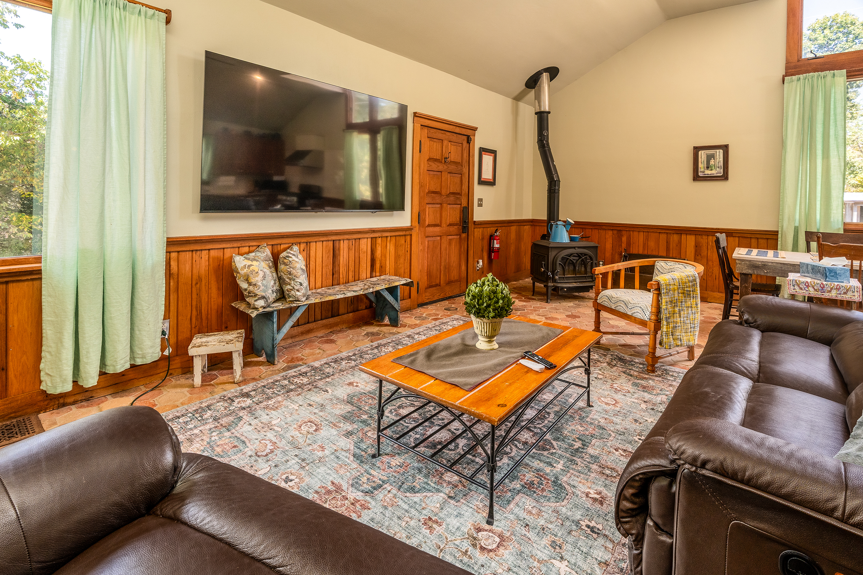 Relax on the reclining leather sofa while enjoying the 86” Smart TV.