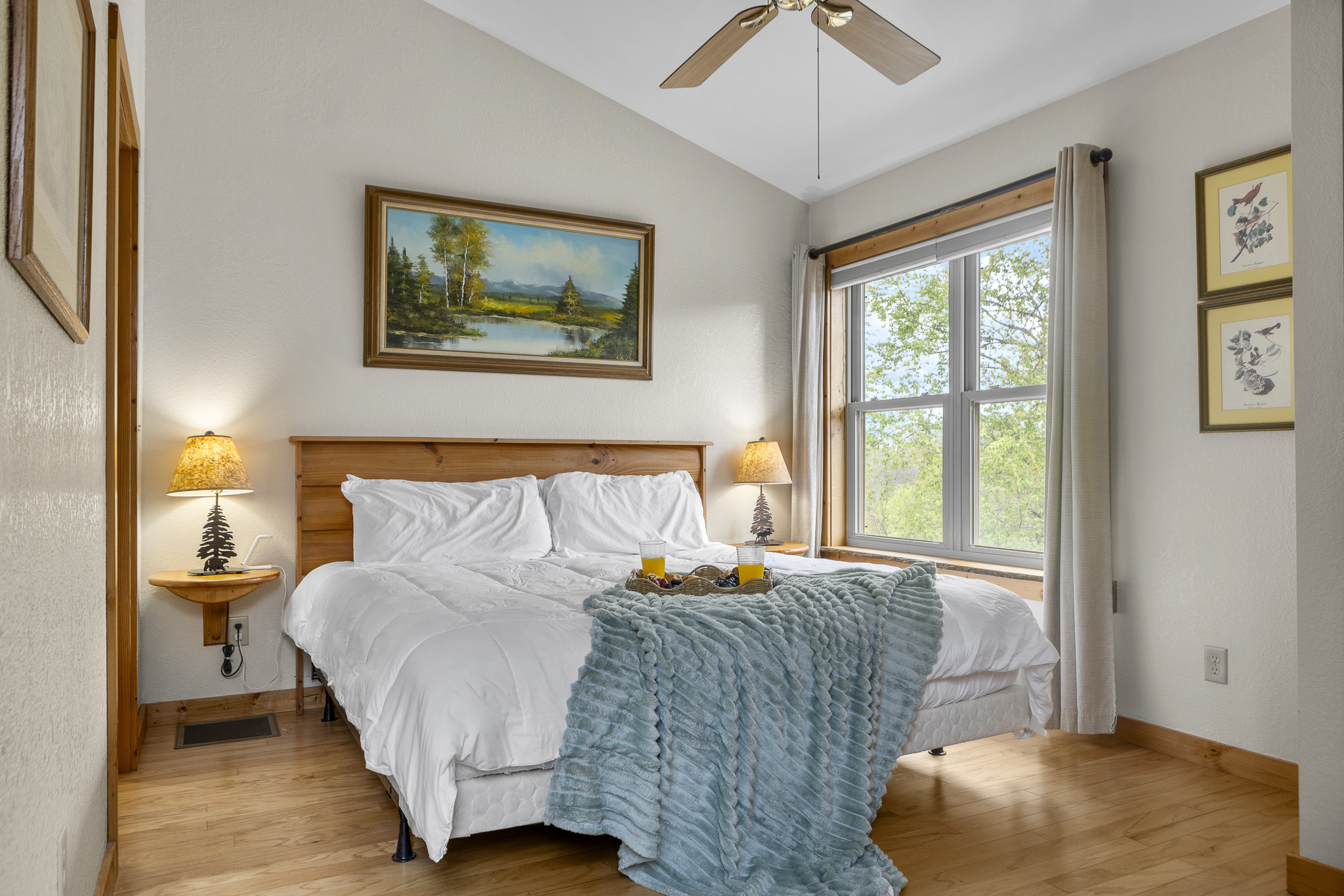 Bedroom Retreat: Bright space with scenic views, soft linens, and warm lighting for restful nights!