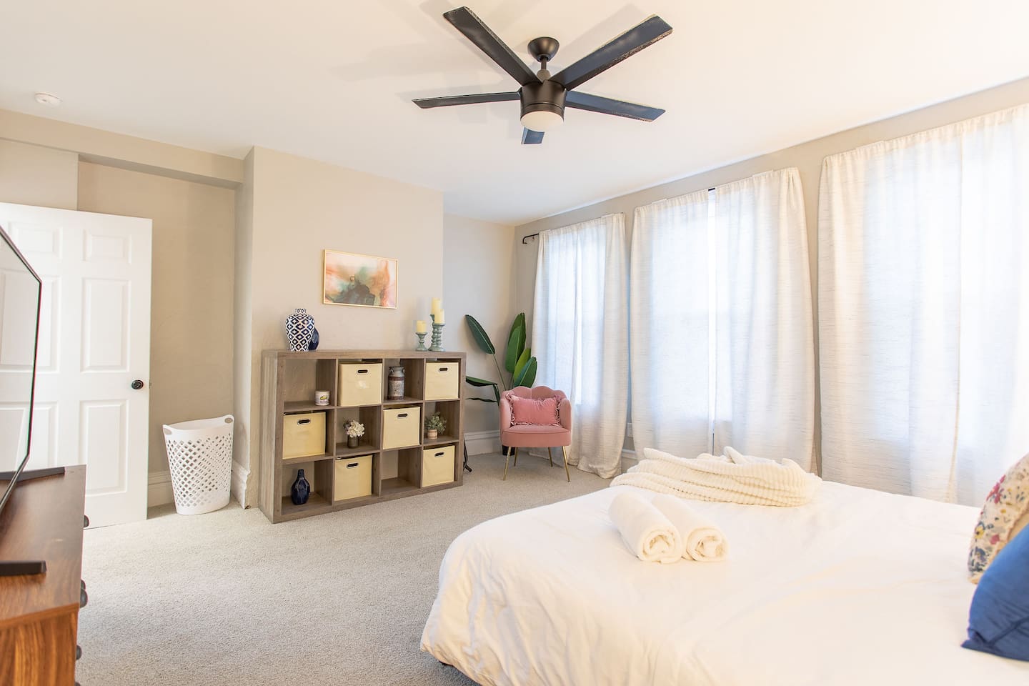 In the King Bedroom, store your belongings in the dresser and cubbies with baskets in the cube storage unit.