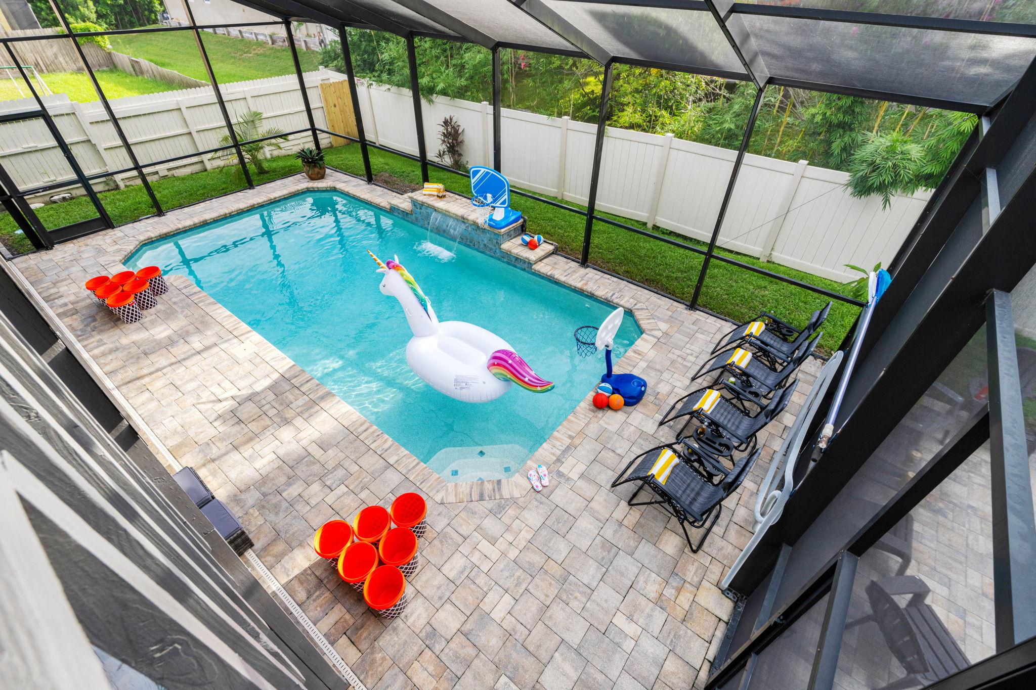 No need to worry about bugs or debris—this screened pool is perfect for long, uninterrupted days of splashing, lounging, and relaxing.