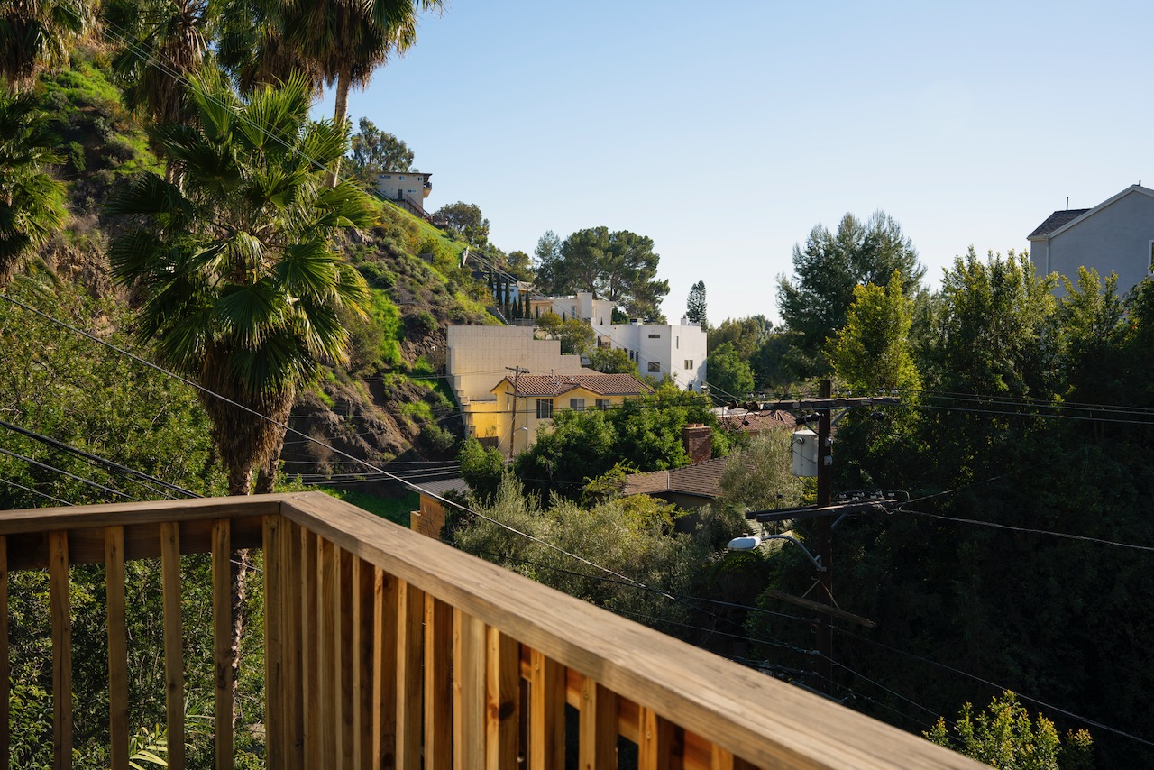 "Above the Fray: Revel in Peace on Your Balcony Set Amidst Trees"