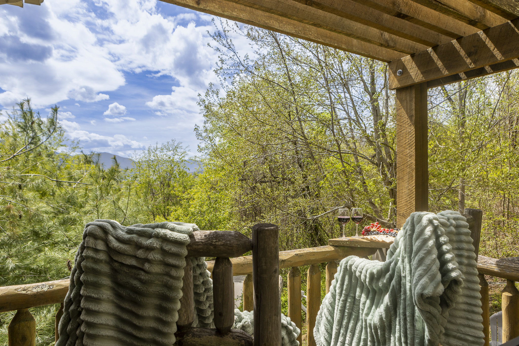 Balcony Retreat: Sip wine on the balcony while enjoying stunning mountain views!