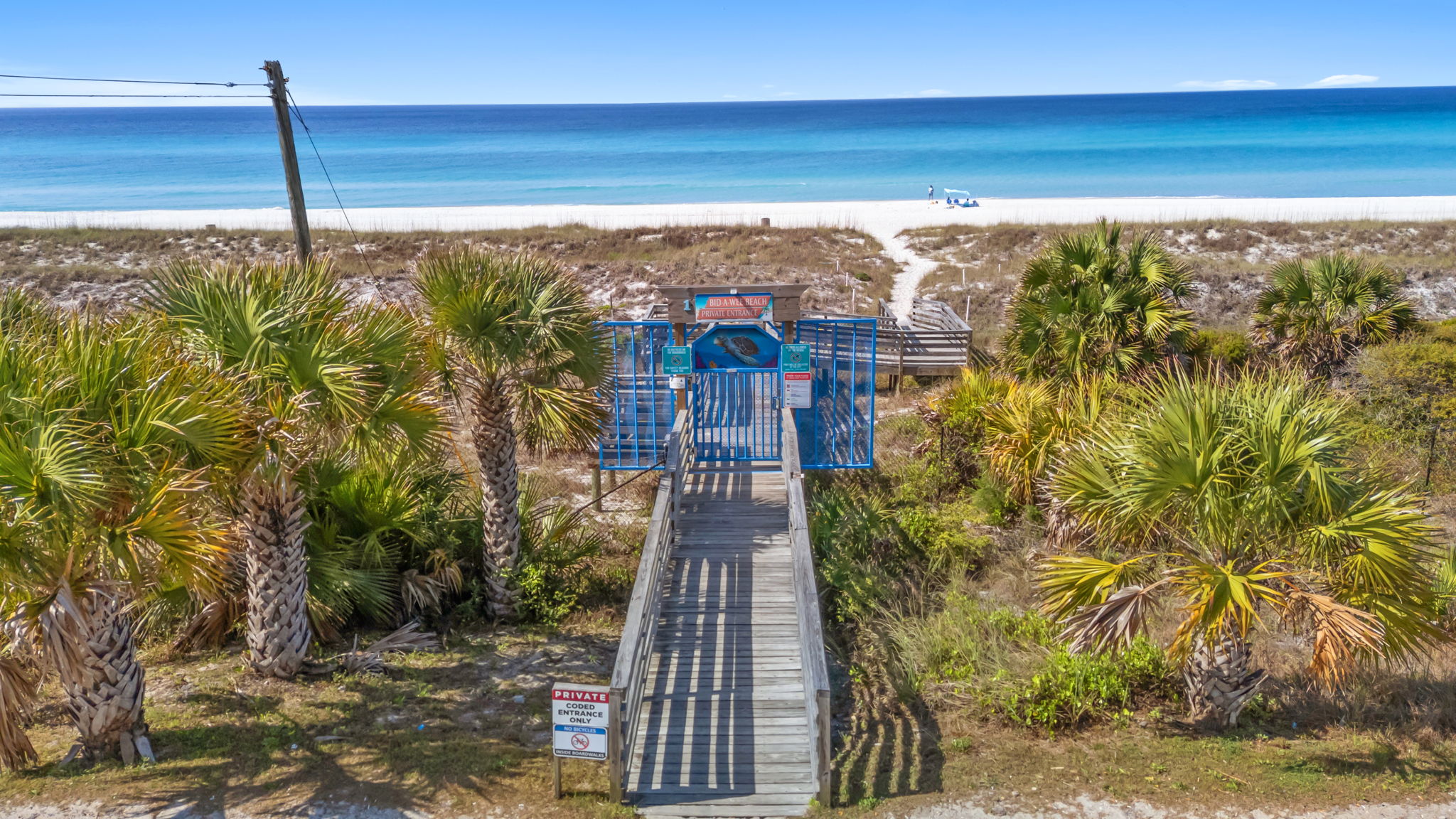Walk out your gate, follow the palm-shaded boardwalk, and
step onto the sand. Your private Bid-A-Wee beach
access puts the Gulf just minutes from the back door.