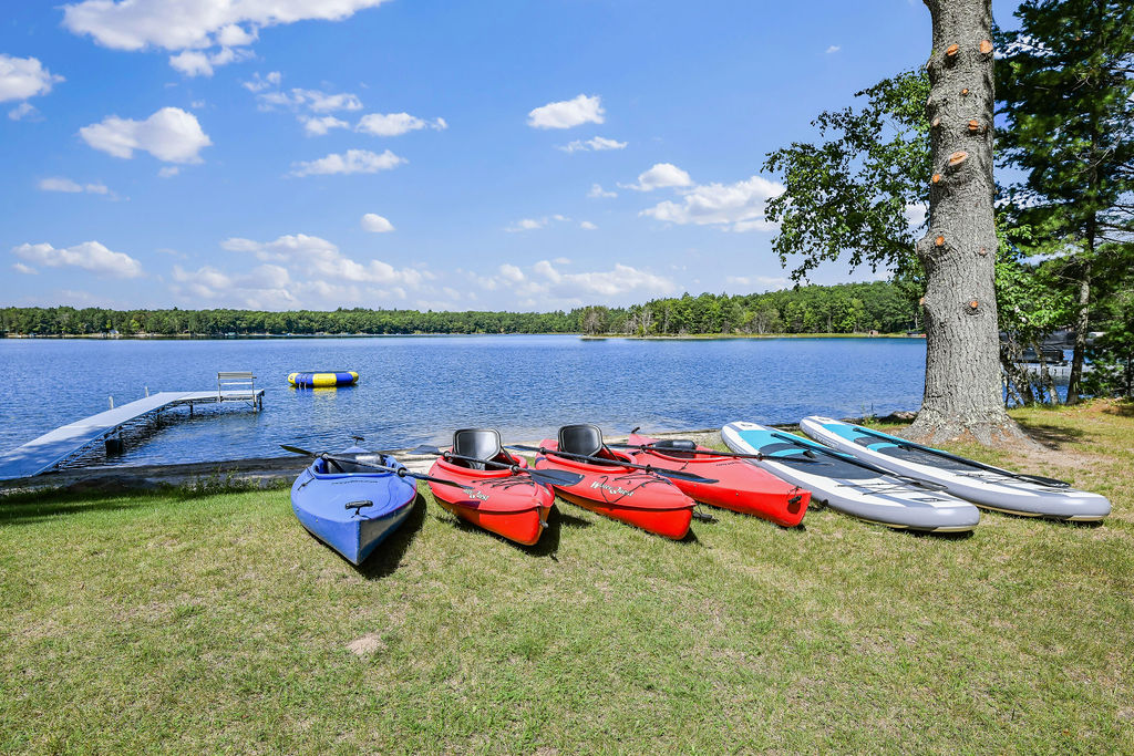 Kayaks, stand-up paddleboards, and a canoe provided