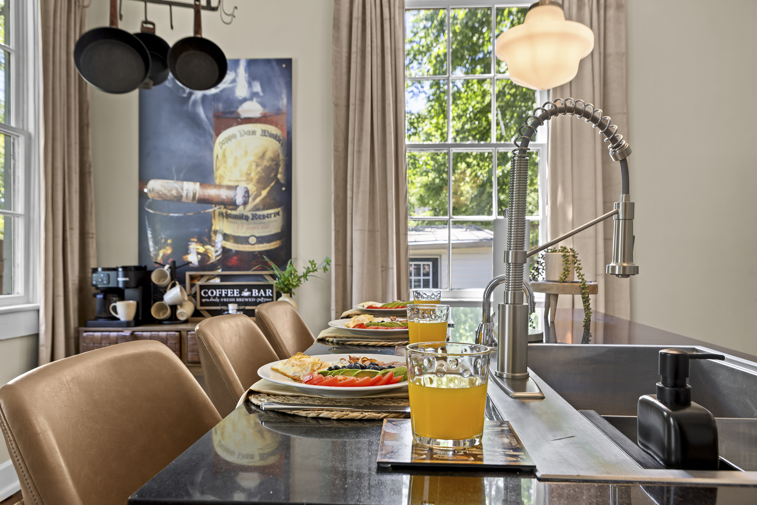 Gather around the island for a hearty breakfast, with eggs, avocado toast, fresh fruit, and orange juice ready for the whole crew.