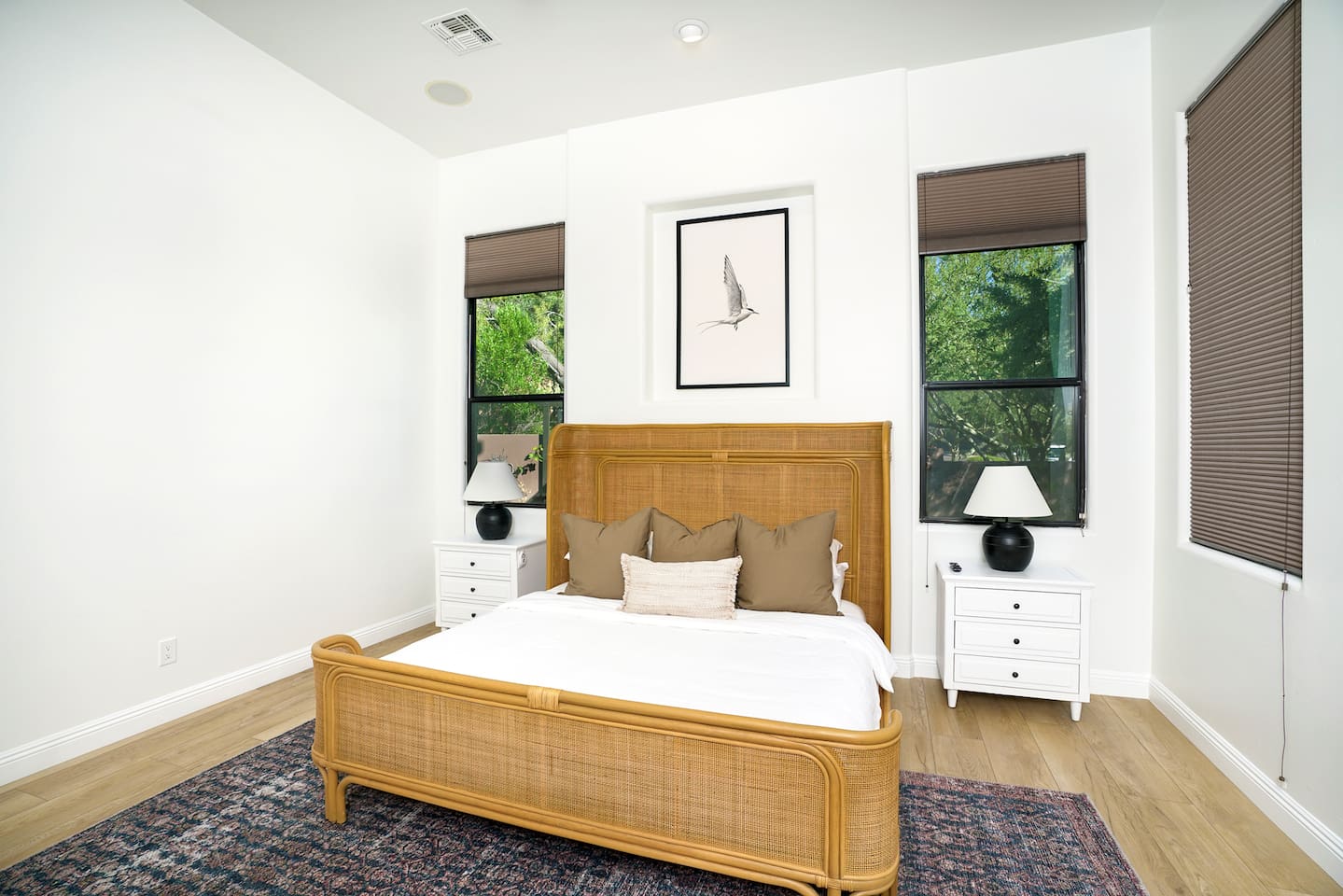 Owners Suite Bedroom includes a gorgeous wicker bed frame that is sure to impress any discerning eye.