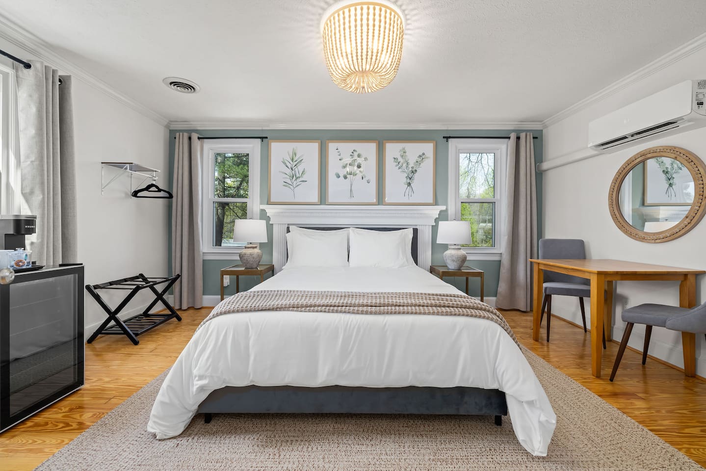 Eucalyptus Suite (Bedroom #2) includes a queen bed, dresser, TV, mini fridge + mini Keurig, and table for 2.