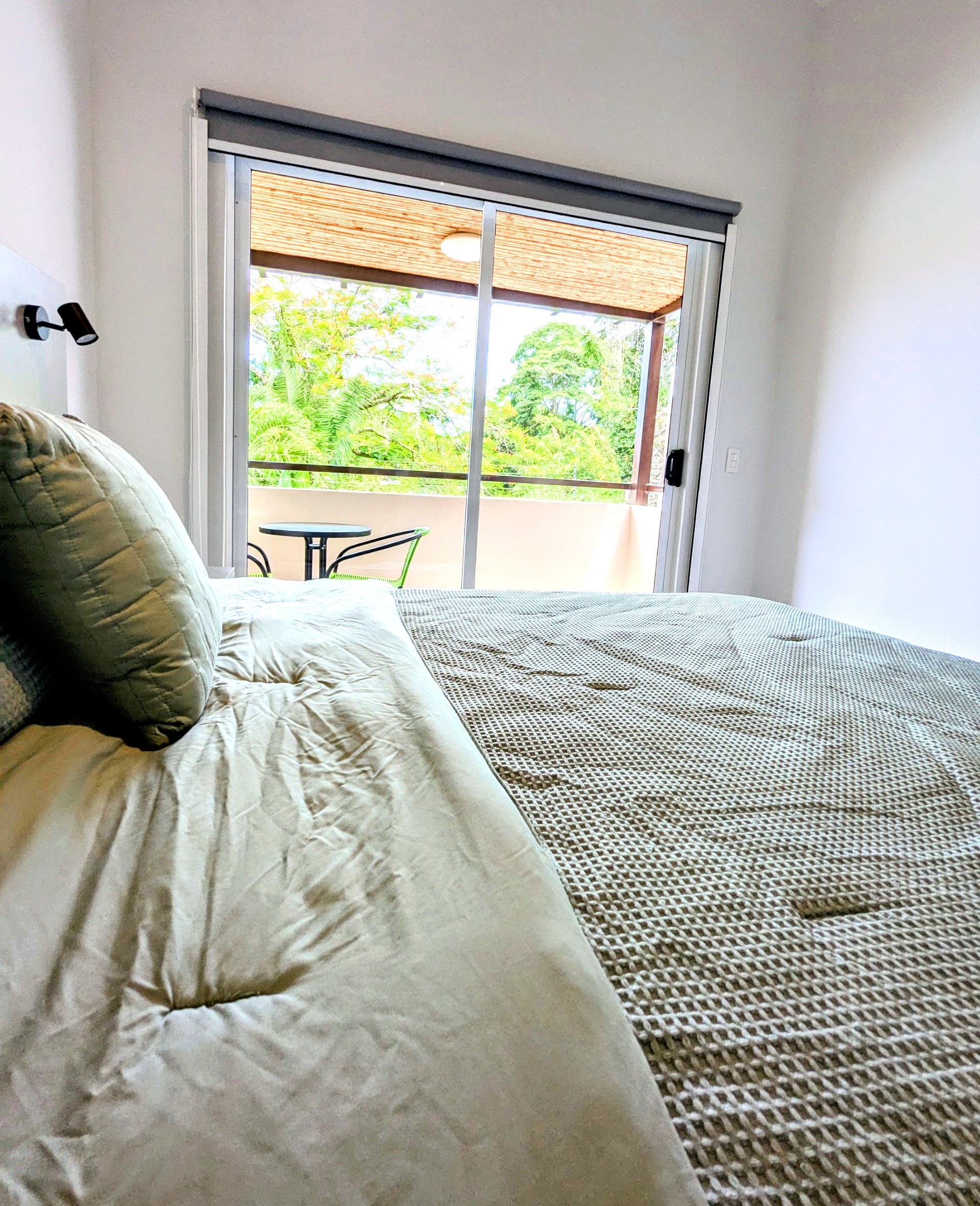 Master Bedroom bed and balcony
