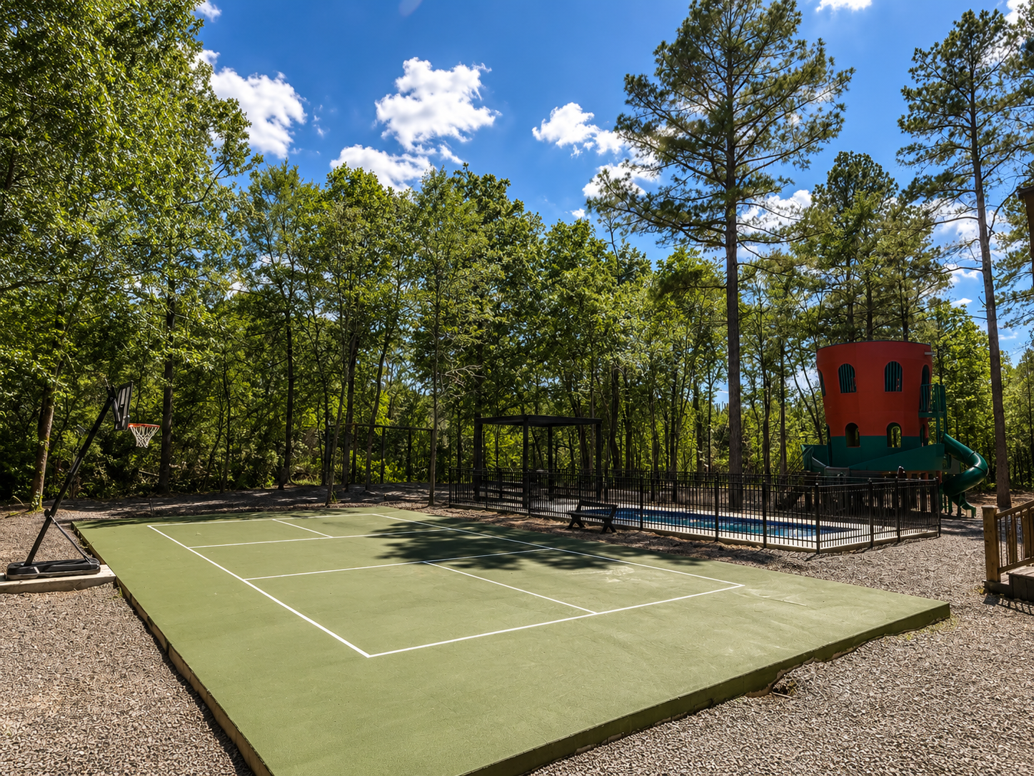 Outdoor Fun Zone: Enjoy games and laughter in a spacious yard with basketball and playground fun!