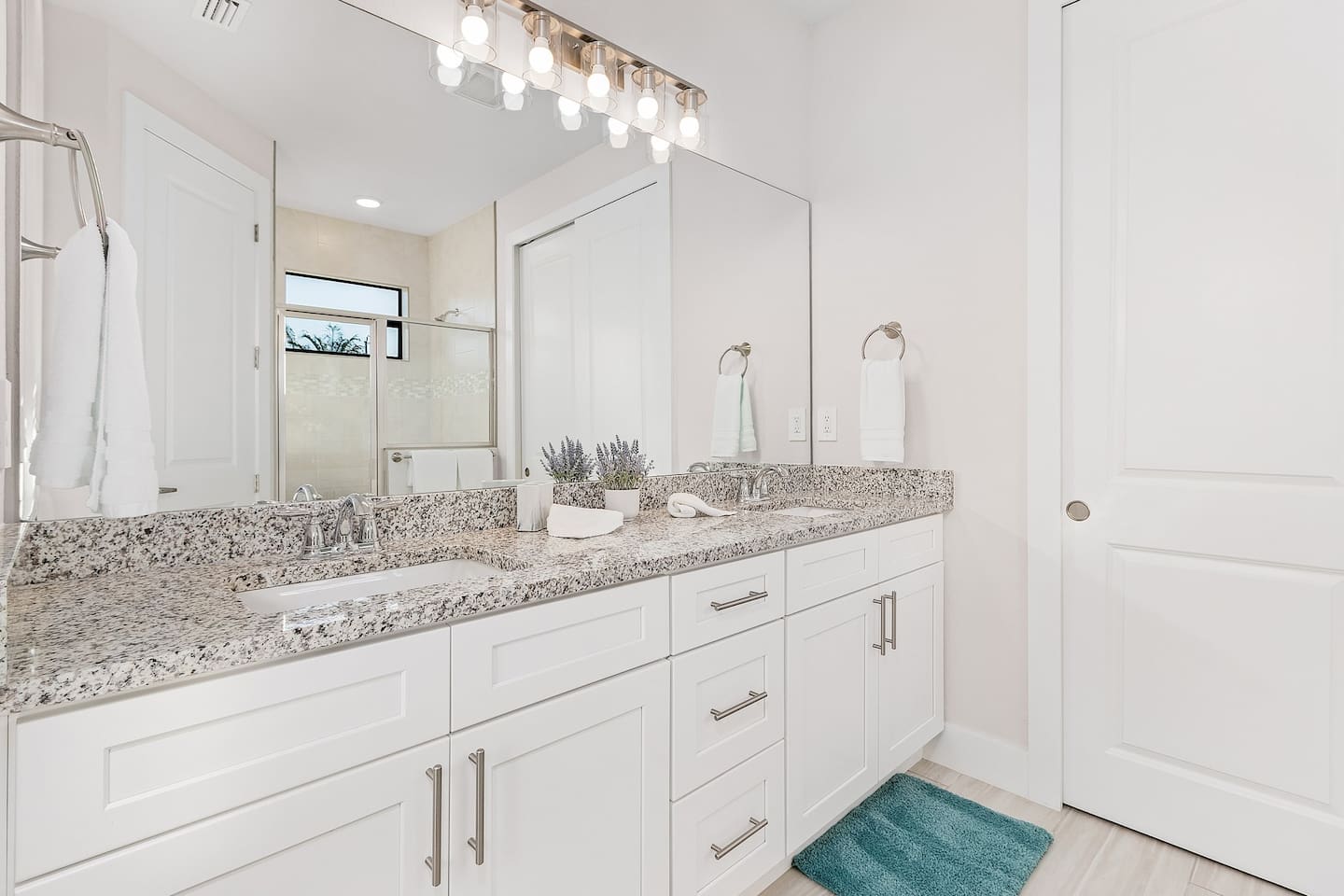 1st Primary ensuite bathroom with dual sink and shower 