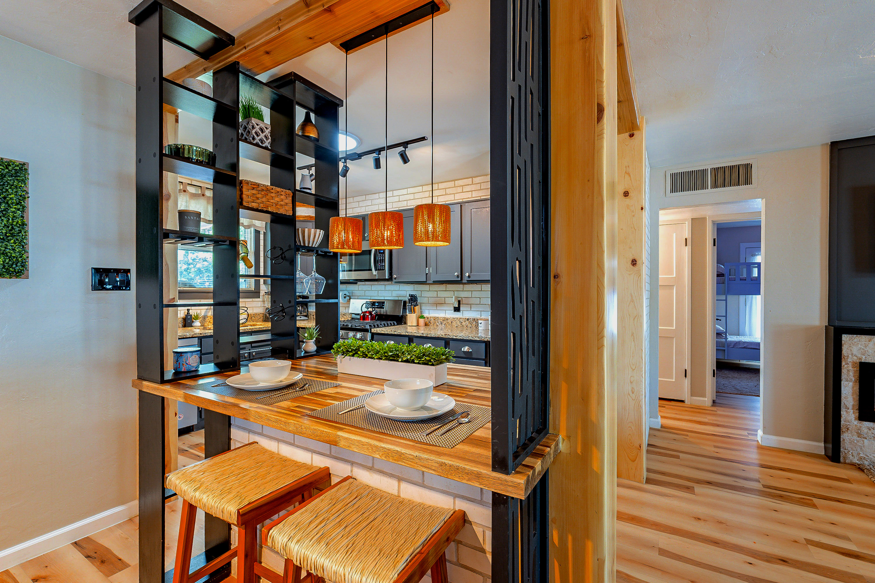 Kitchen Nook: Enjoy meals at this stylish bar with pendant lighting and modern decor!