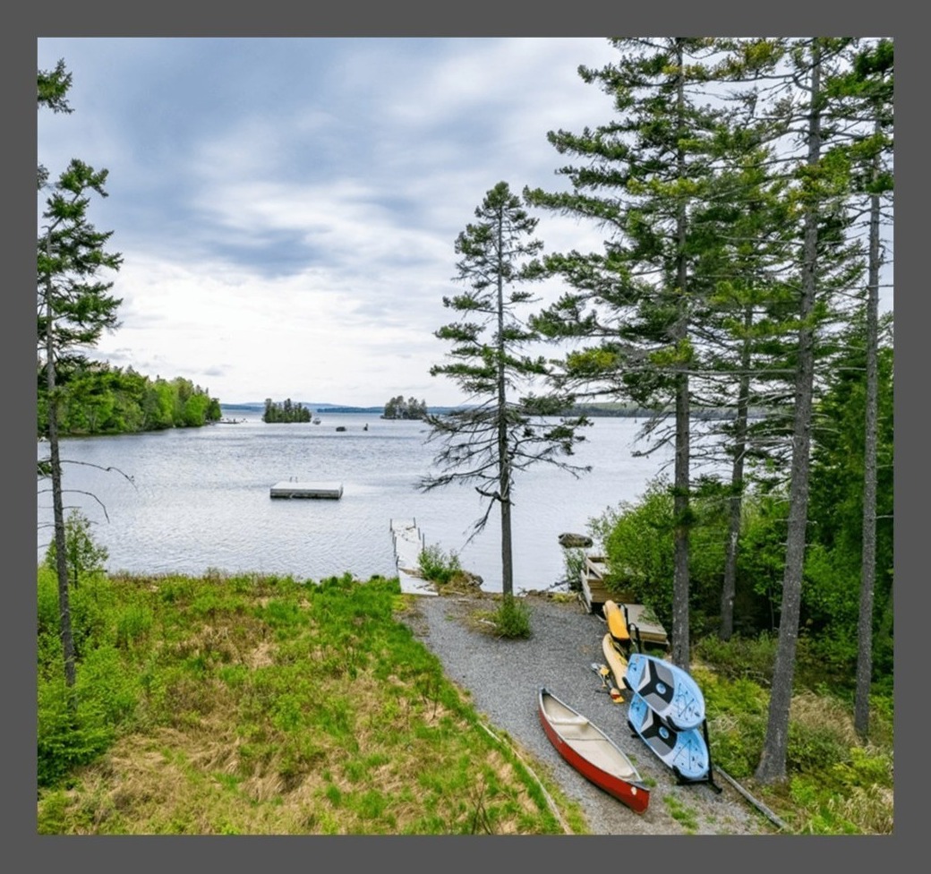 Canoes and paddleboards on the private waterfront at Lily Bay Chalet