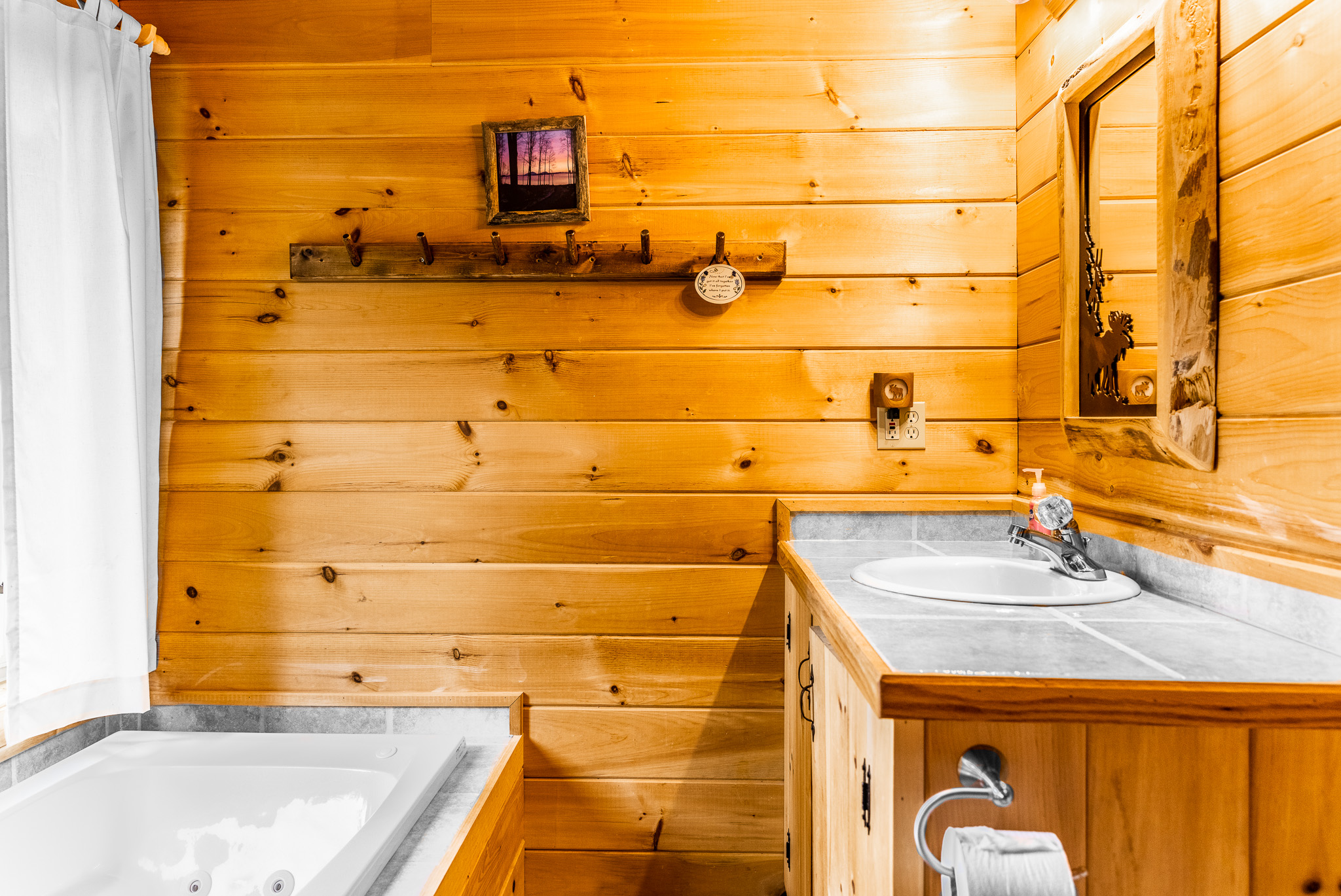 The private bathroom off of the main floor master ensuite, with a soaking jet tub plus a separate shower.