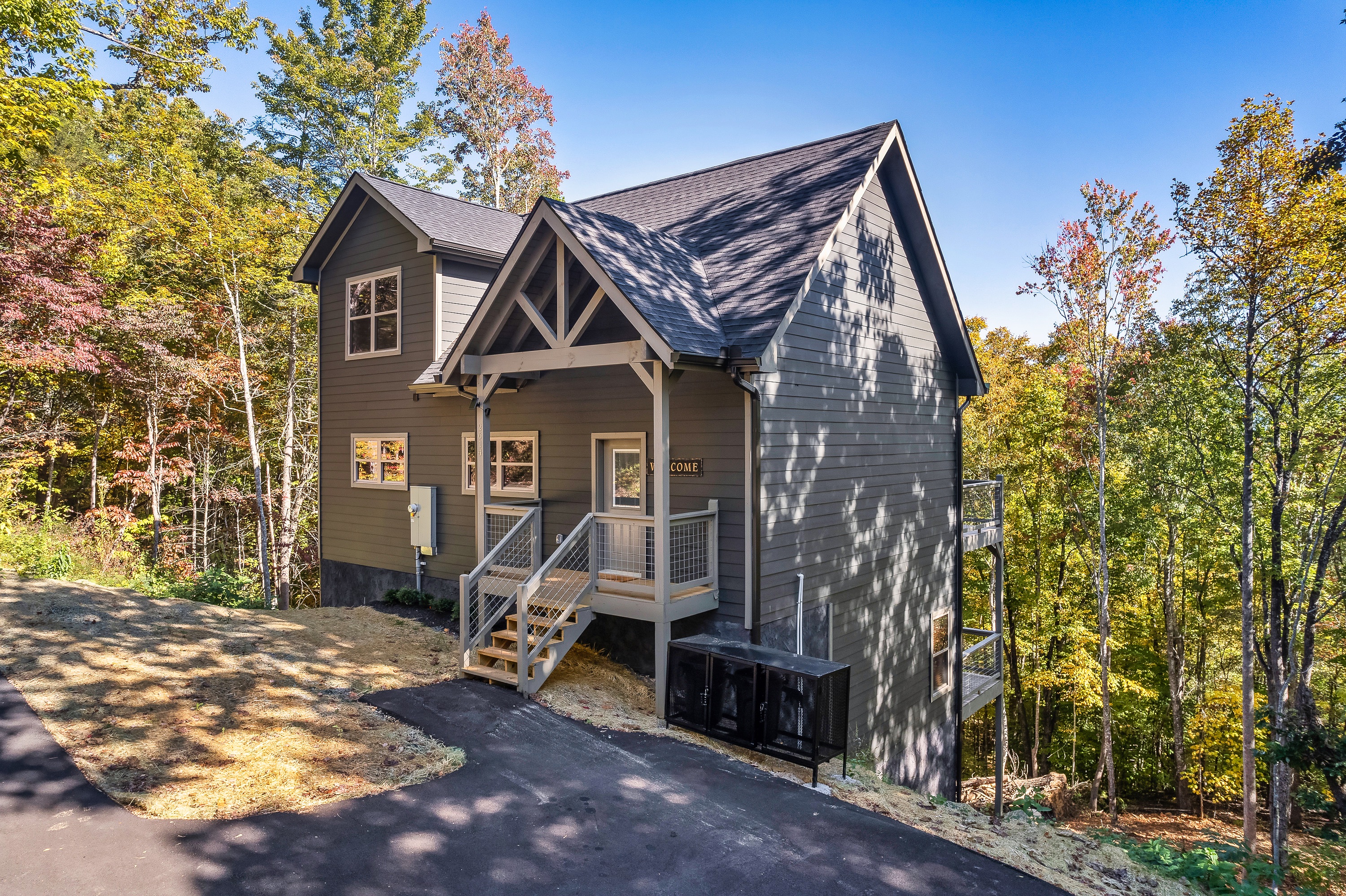 A private Smoky Mountain retreat surrounded by mature trees.