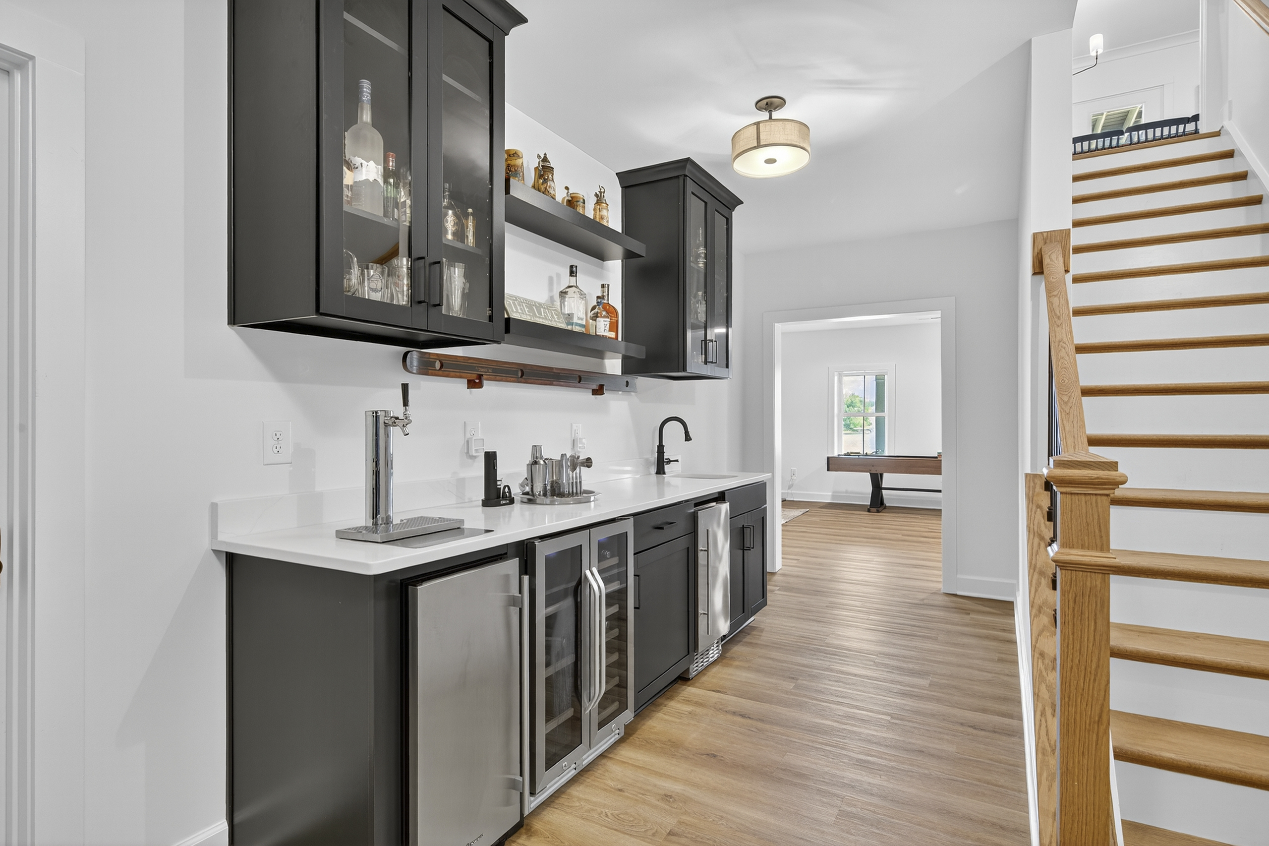 Sleek wet bar with beverage coolers—entertain in style.