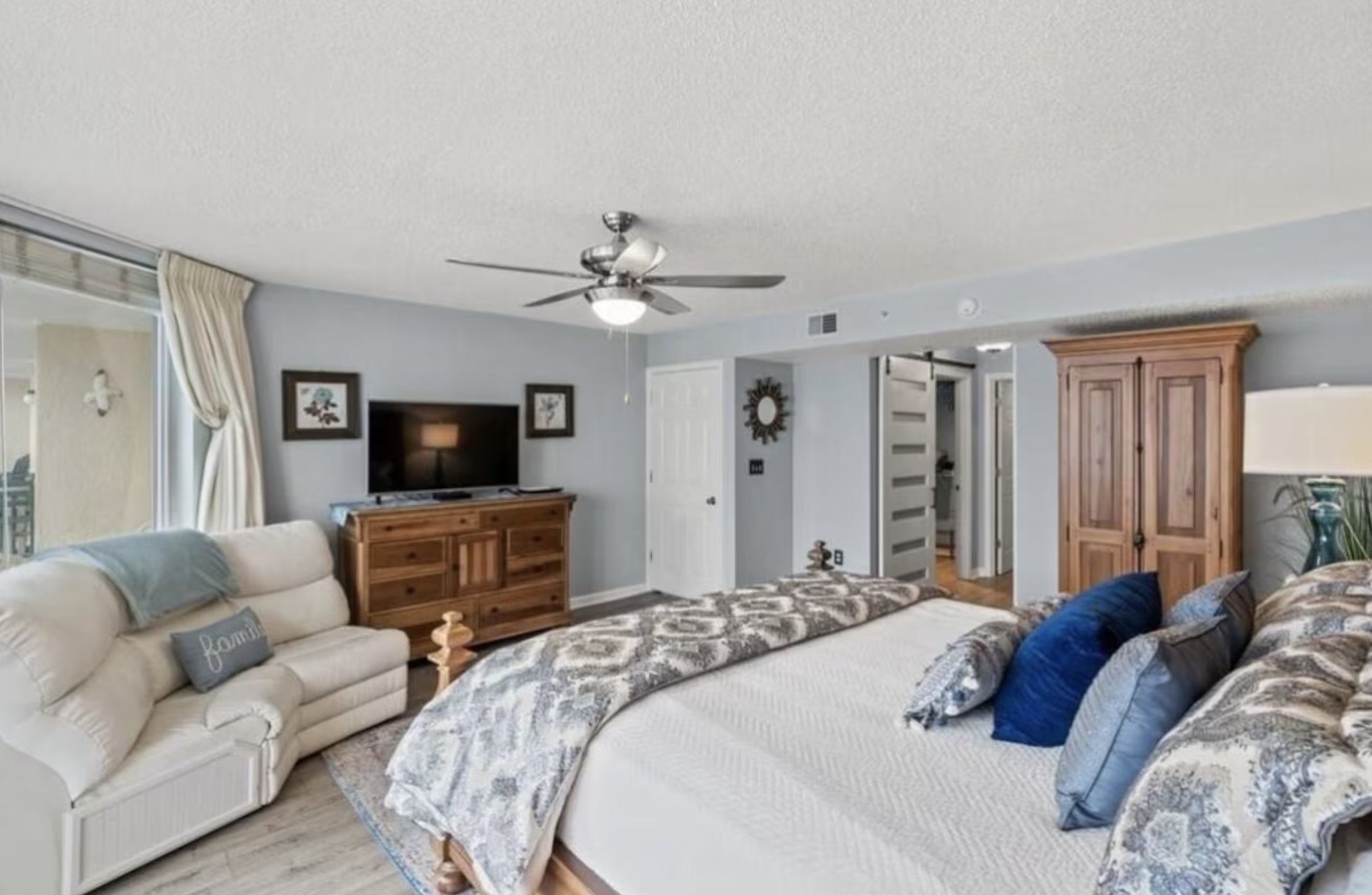 The primary bedroom has all the space you need and comes with a king bed and your own private access to the balcony