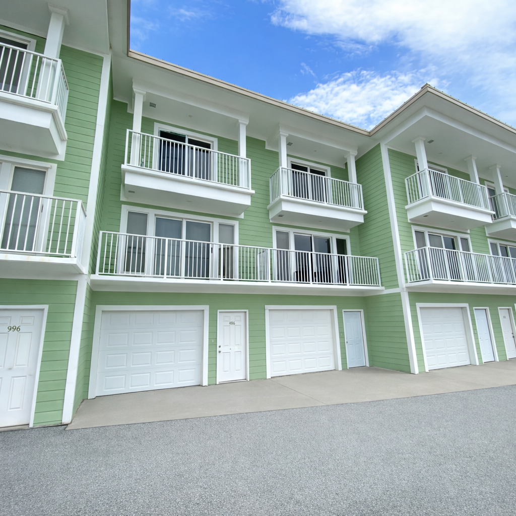 Townhome exterior featuring private garage parking