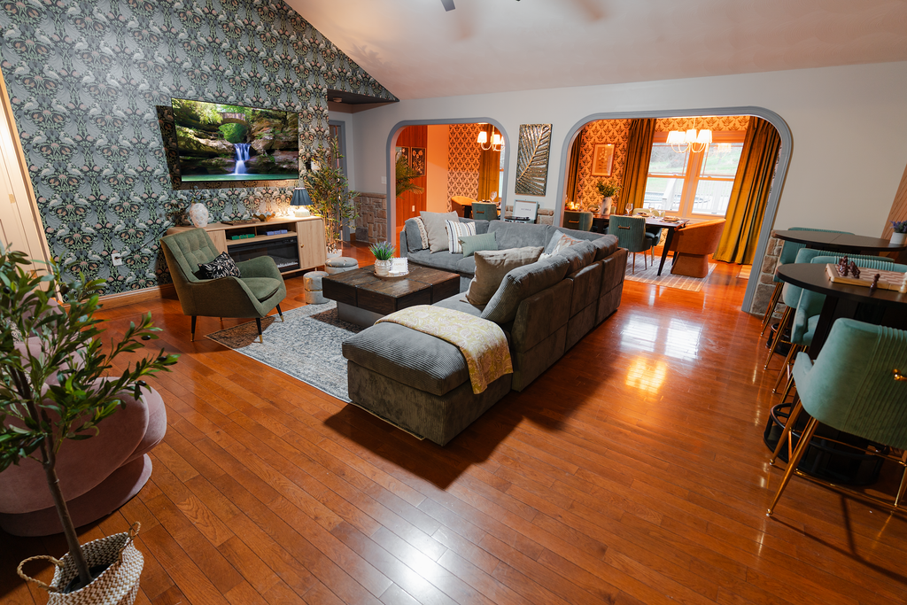 This large living room is set up for group hangouts, with plenty of seating and an open feel throughout.