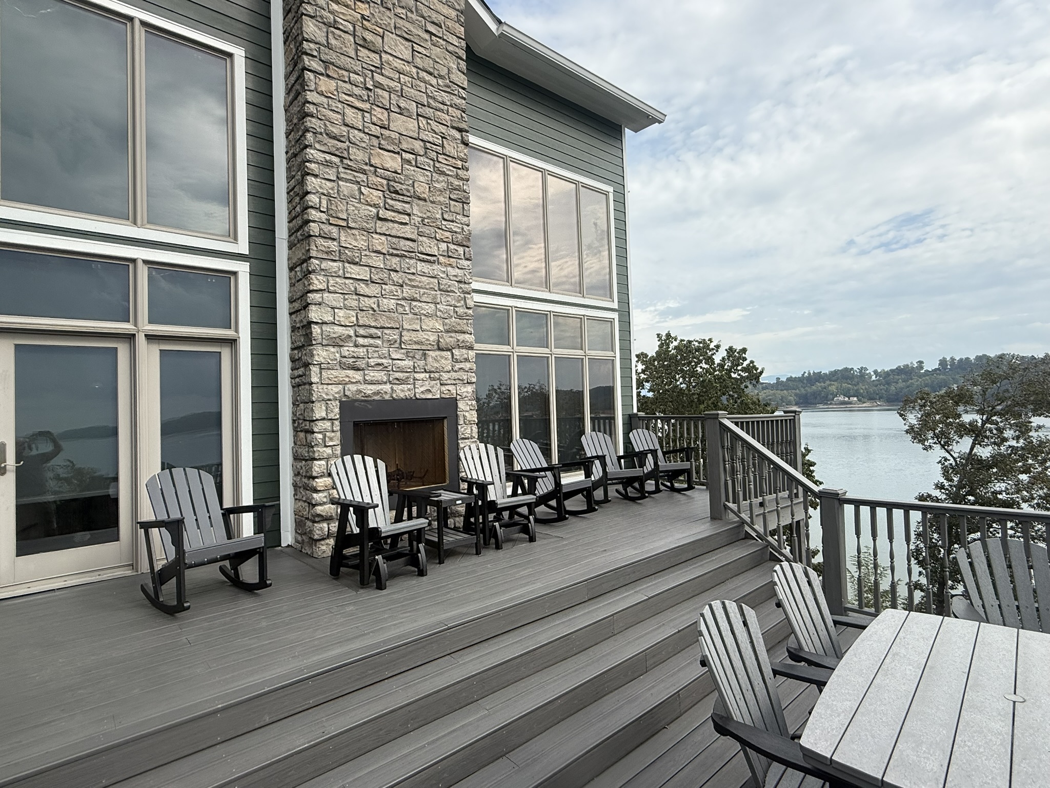 Back deck overlooking Douglas lake; 2-story windows in living room
