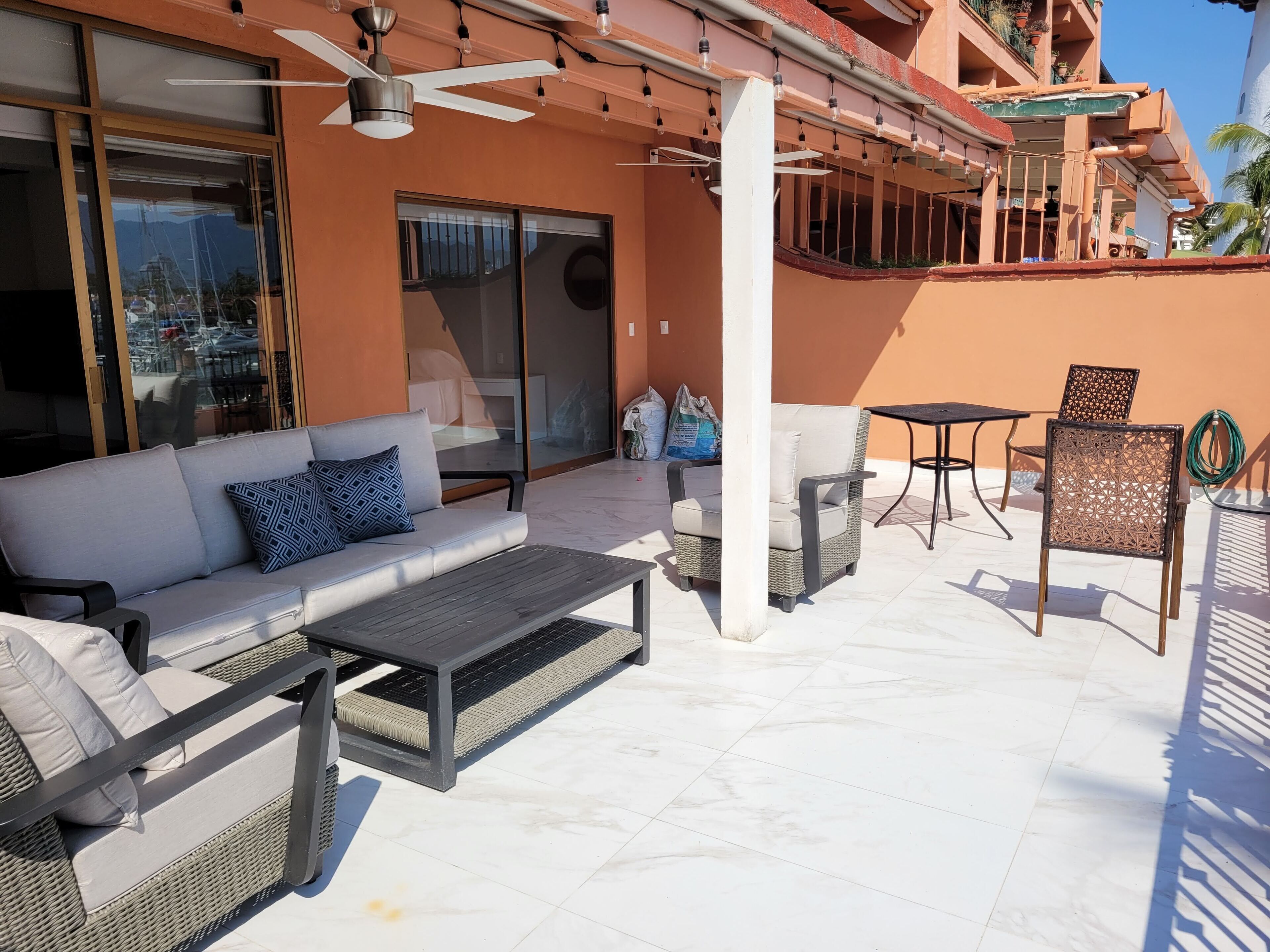 Living room and master bedroom overlooking the terrace and the boats