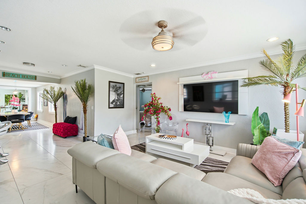 Entryway of the house comes directly into comfy couches and living room.