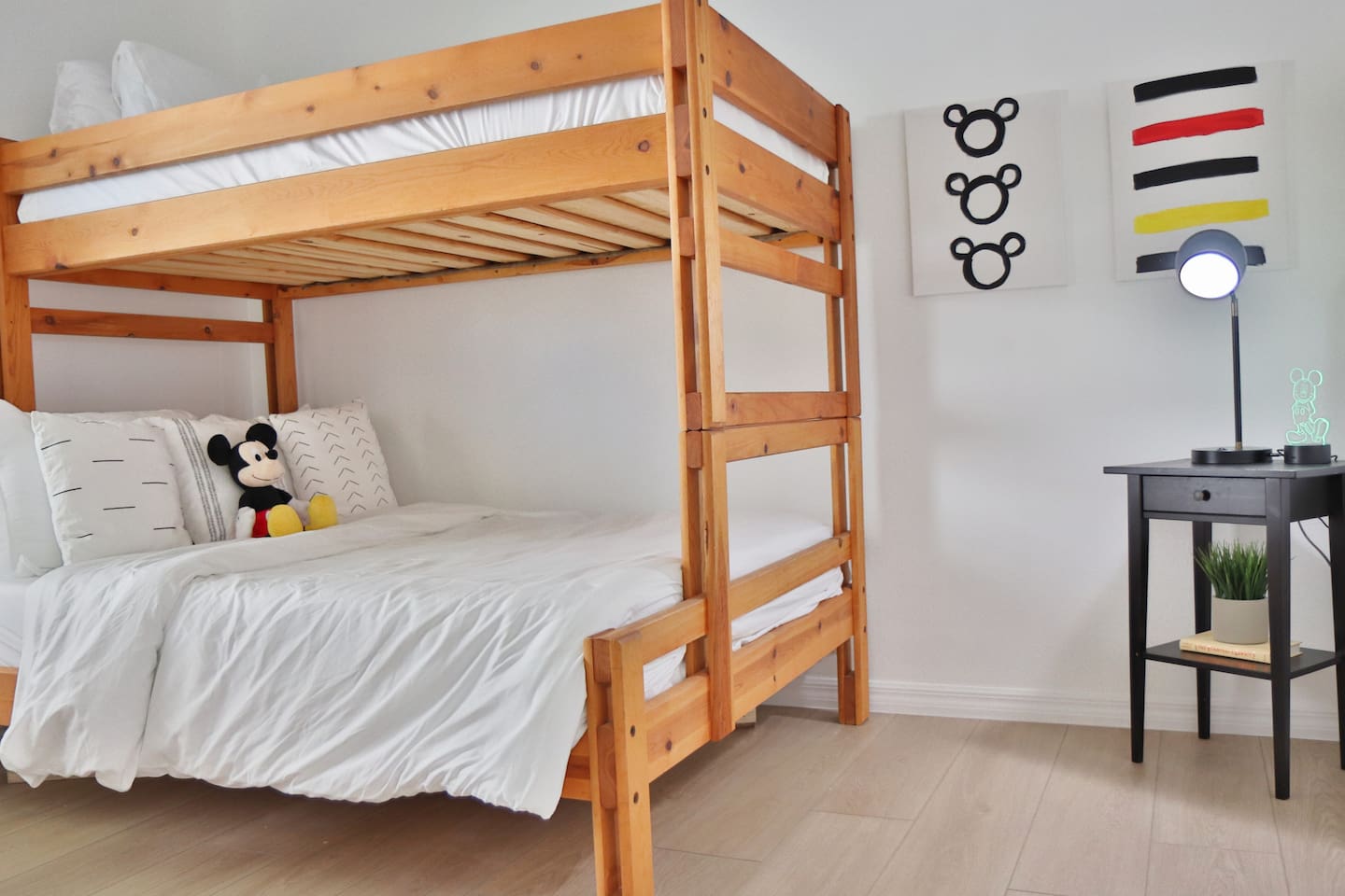 Fun Mickey Mouse themed bedroom with a Twin over Full bunk bed and black out curtains 