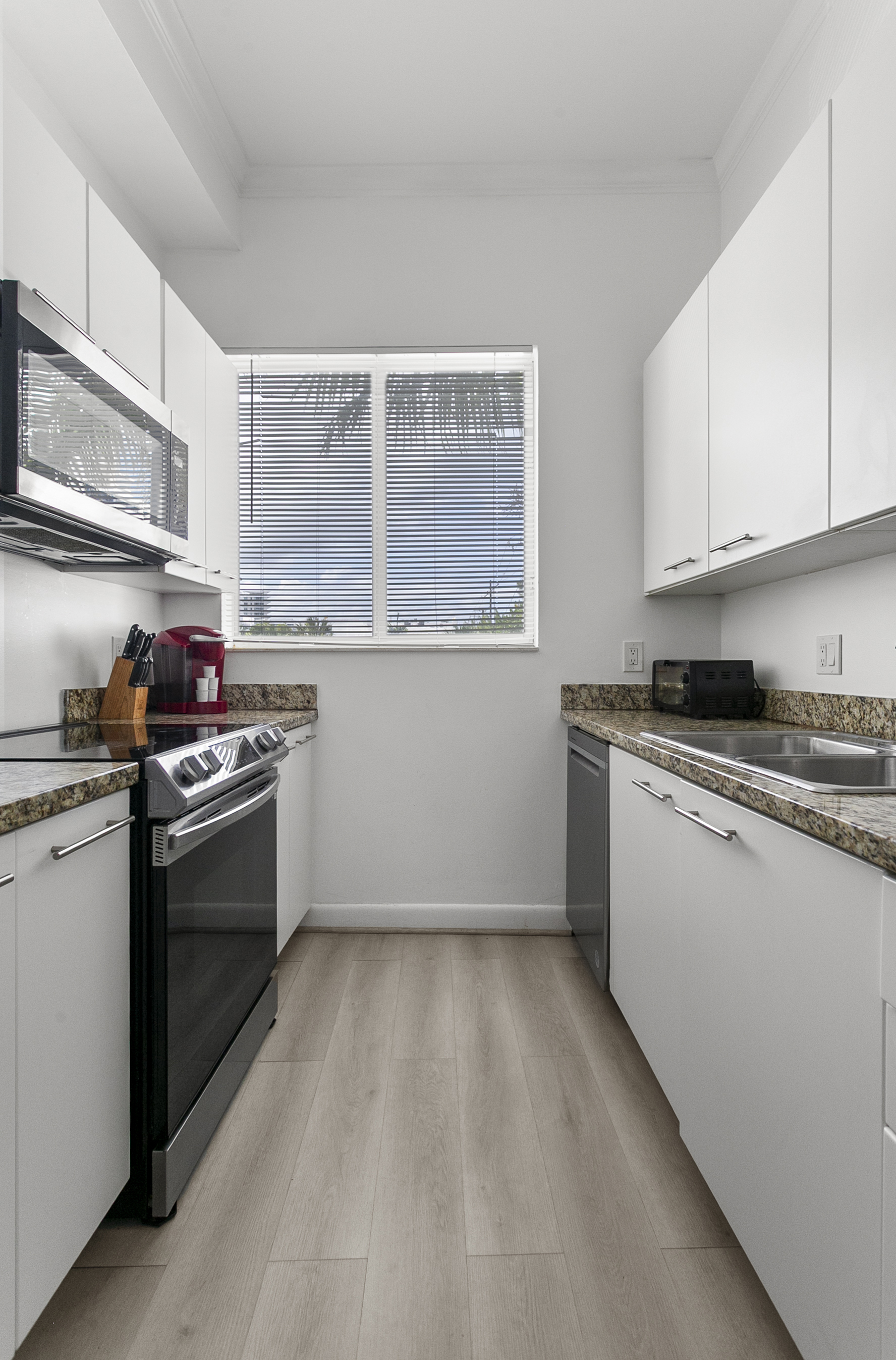 Fully equipped galley kitchen, stocked for daily meals or family cooking