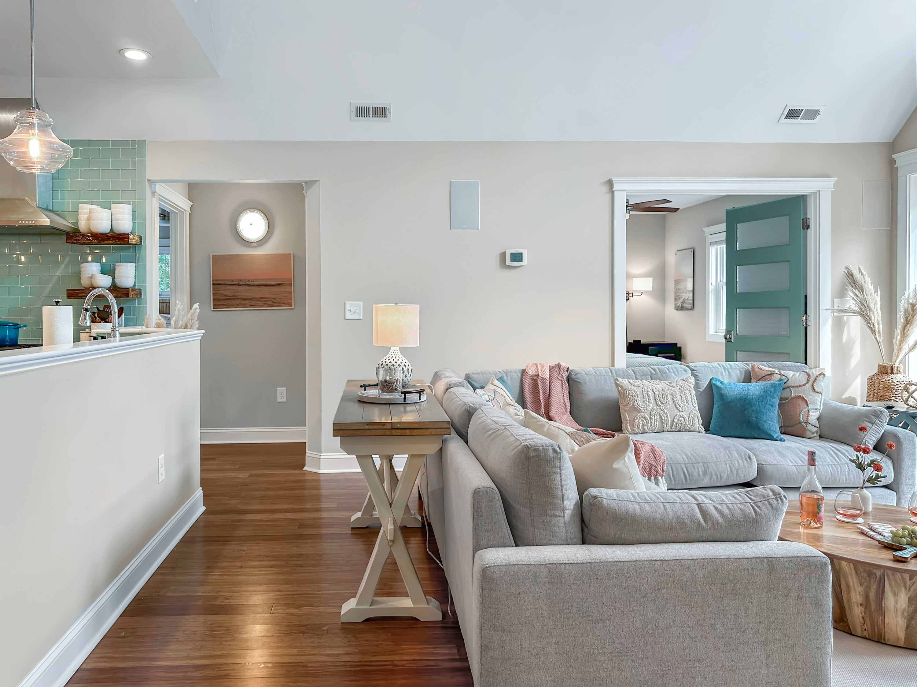 The Living Room joins seamlessly with the Kitchen. (King and Queen bedrooms are in the background).