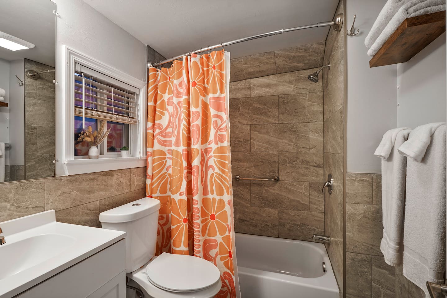 Master bathroom with modern fixtures, bold decor, extra towels and washcloths, shampoo, conditioner, body wash, and all the essentials for your stay.