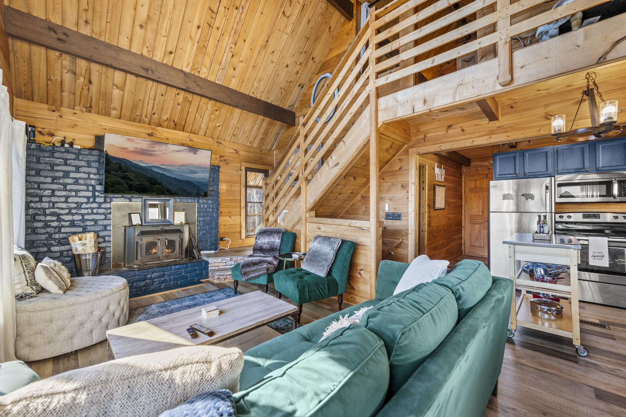 Comfortable plush seating in main living area allows enjoyment of views and entertainment for whole family.  The current green sofa has been replaced with a comfortable leather Crate and Barrel lounging sofa not pictured yet.