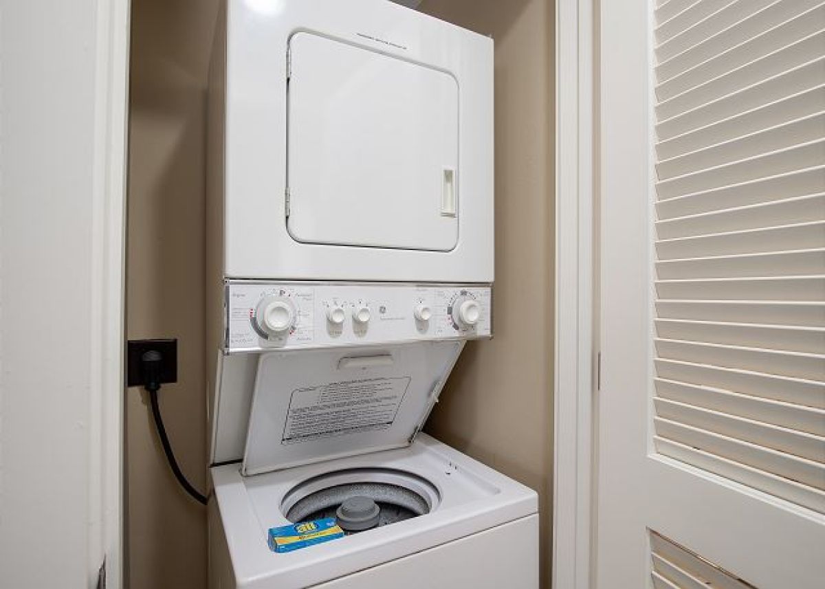 Stackable washer and dryer in the hallway closet for laundry during your stay