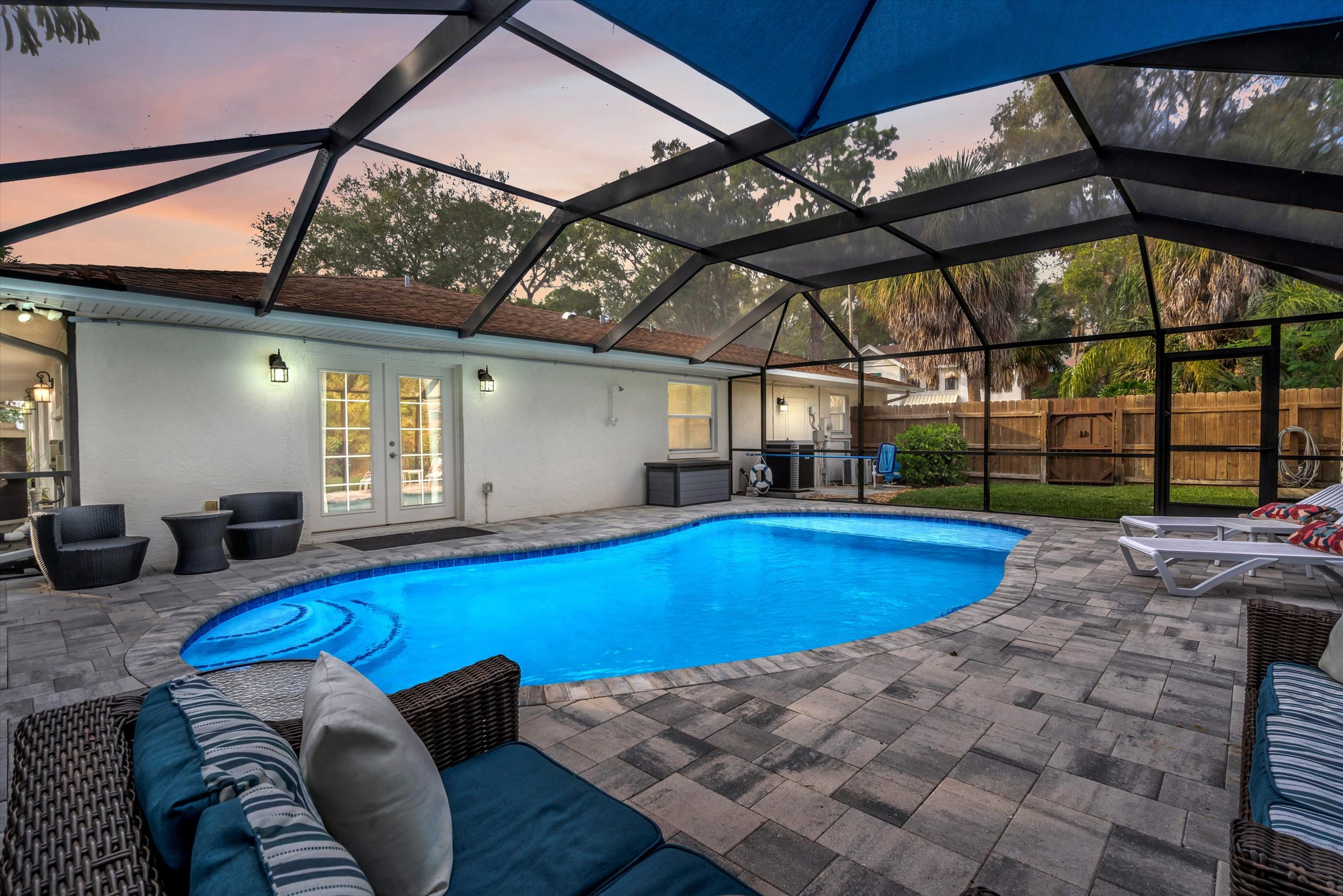 New Heated Pool with Tanning Ledge!   Color changing pool light!   Private yard with beautiful tropical plantings.