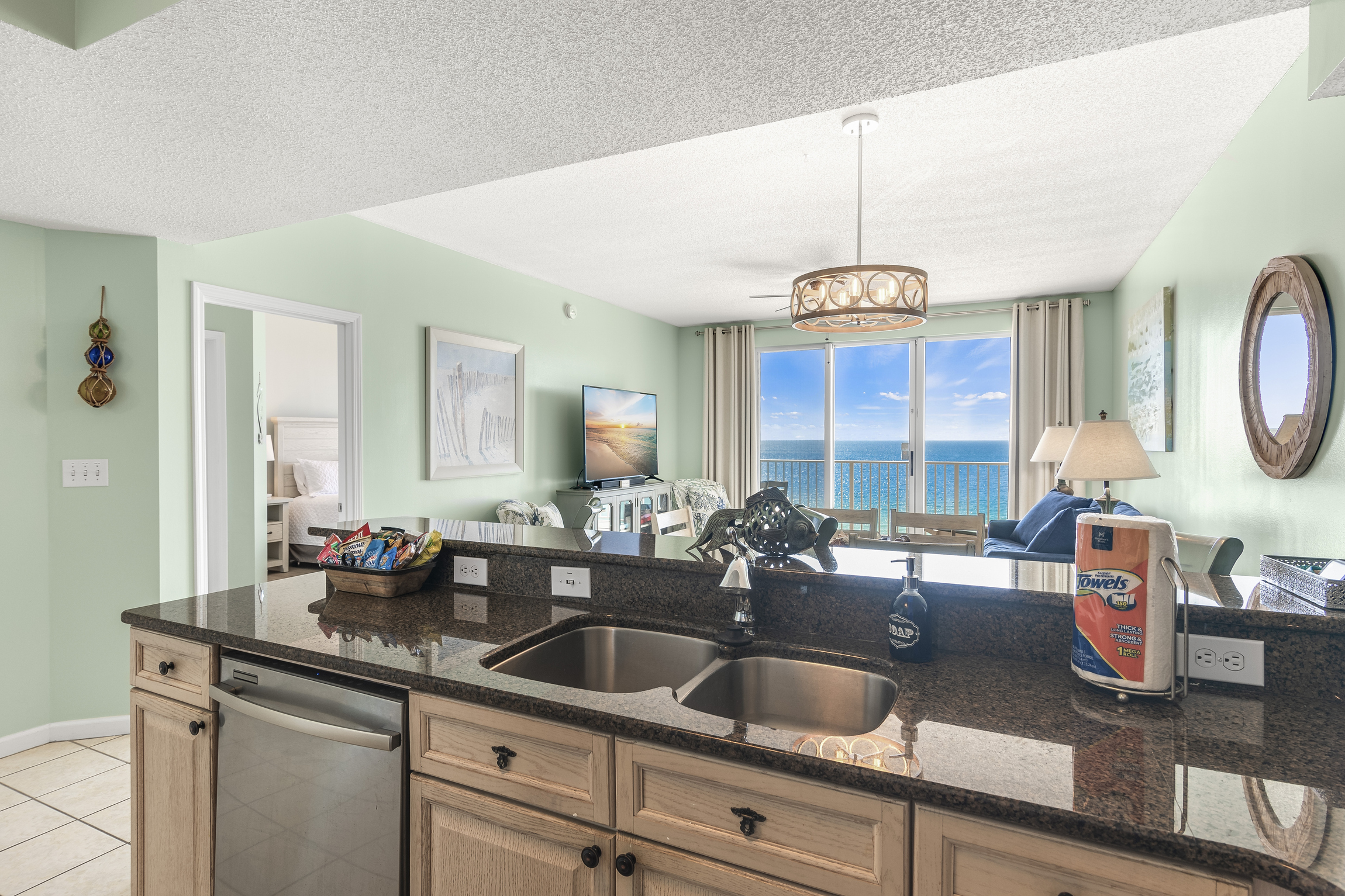 Kitchen has GULF VIEWS, granite countertops, stainless appliances - fully stocked with more than the basics (coffee/tea bar, oils/spices, Tupperware, plenty of pots/pans/cookware)