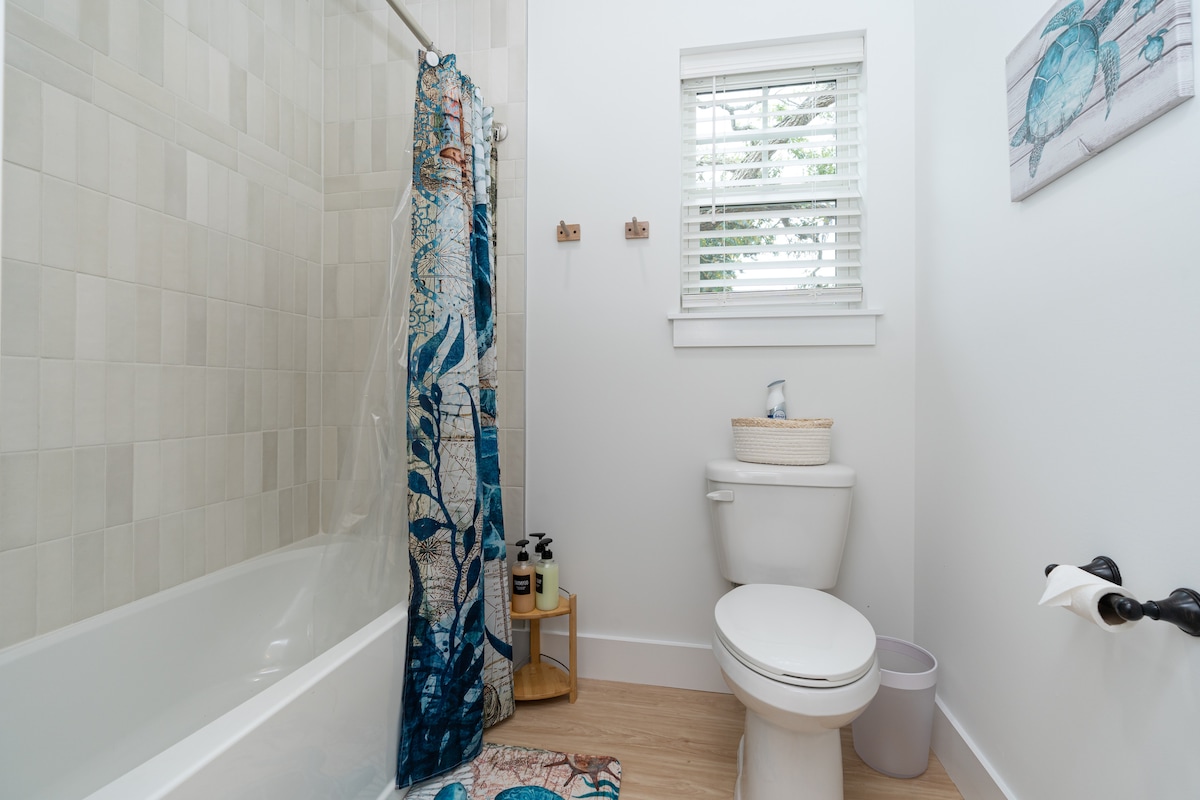 A proper tub, which is the difference between bath time and a battle when small children are involved. Sea-turtle towels, a window above the toilet, and somewhere to soak a sunburn at the end of a long day.