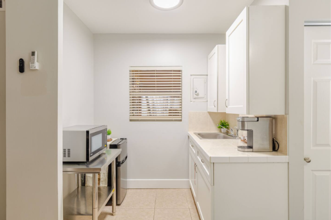 Kitchenette inside of bedroom 3. 