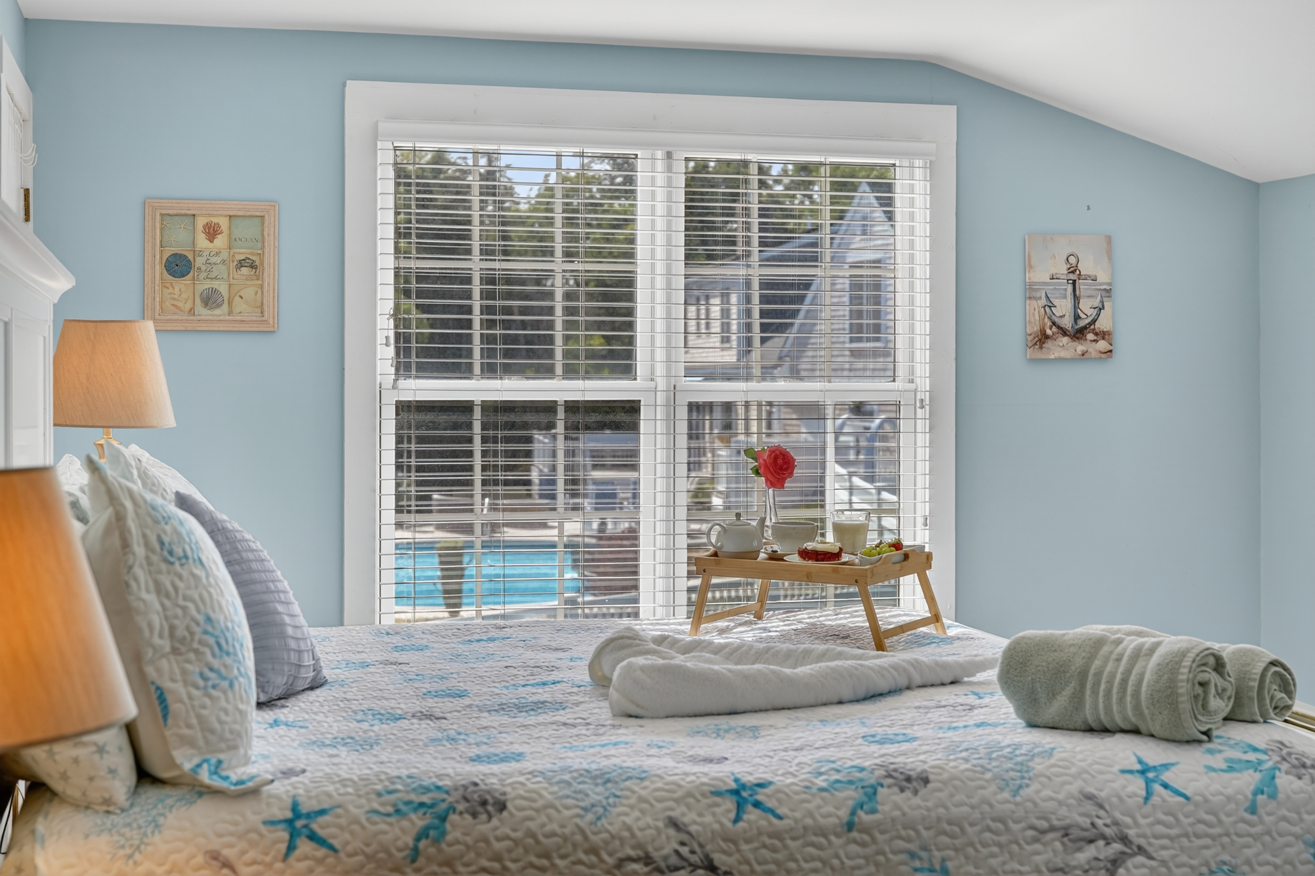 Wake up to natural light in this inviting bedroom, thoughtfully designed for a restful stay.