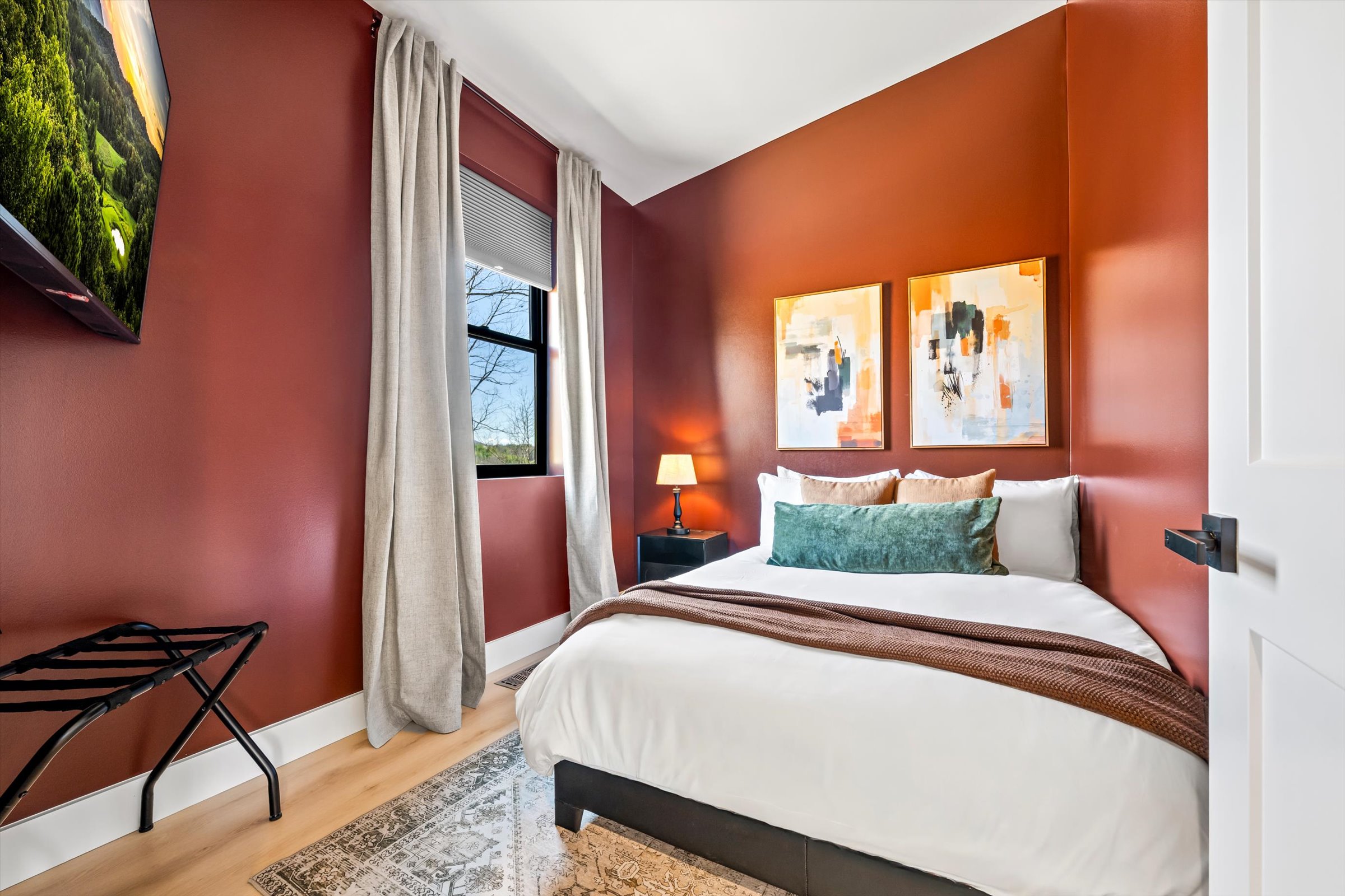 {Full Bedroom}
Warm tones, clean lines, and thoughtful details — a full bedroom with 55 in Roku TV and built-in luggage storage that makes settling in effortless.