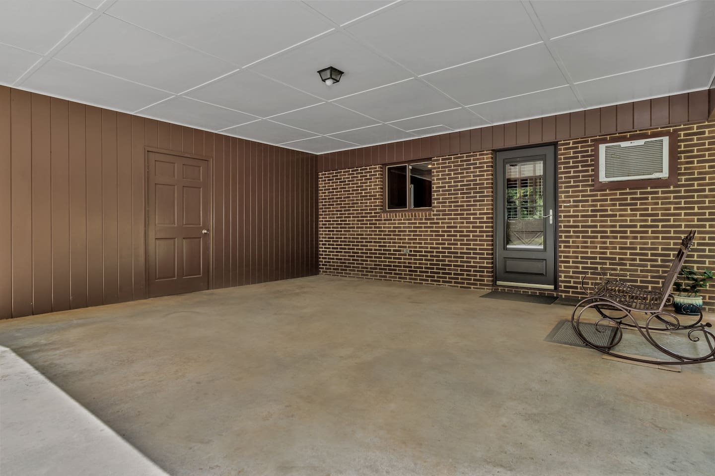 Carport - Door on Left leads to Laundry Room, Door on Right leads into the Kitchen