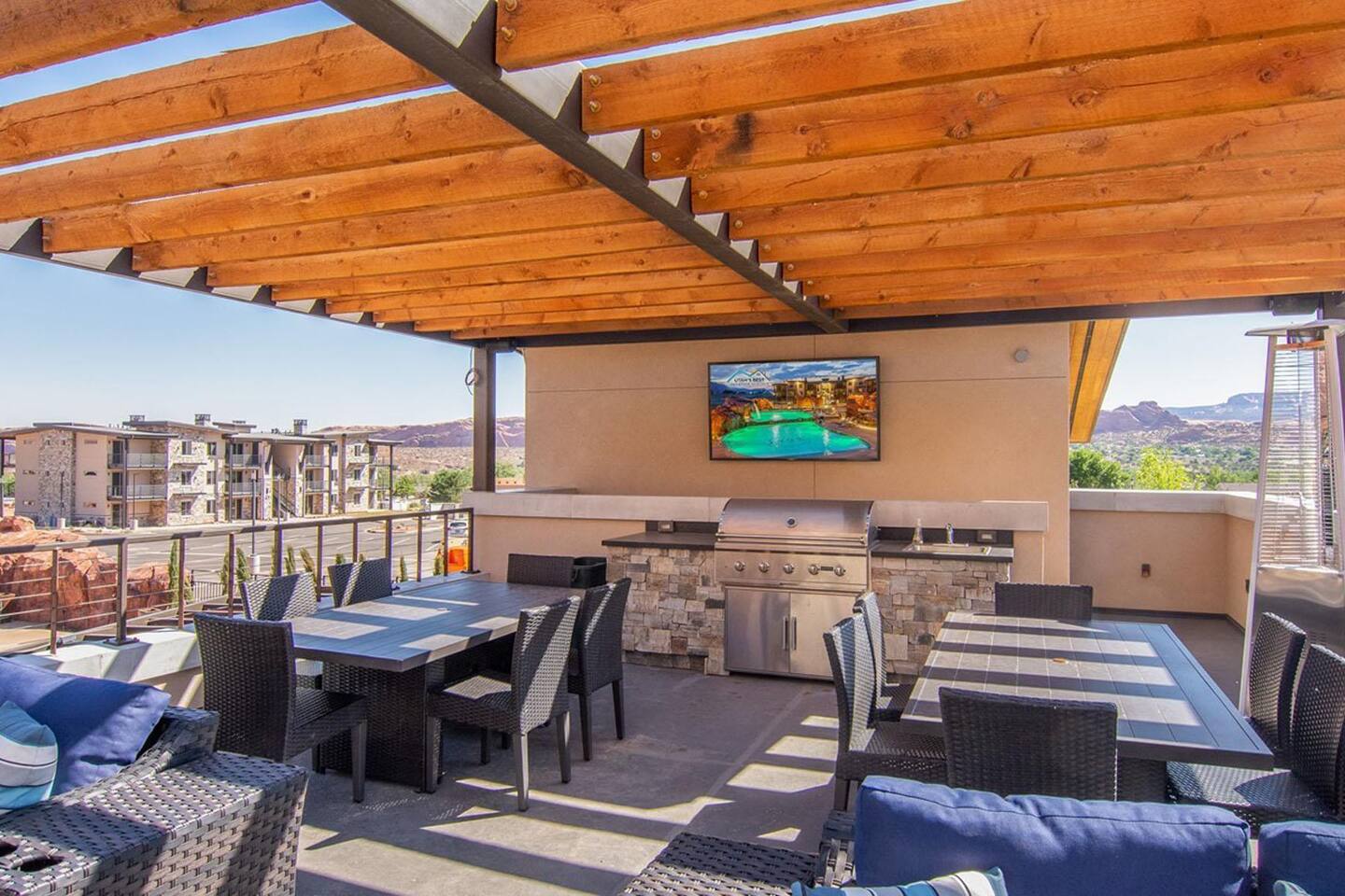 TV and barbecue on poolside lounge