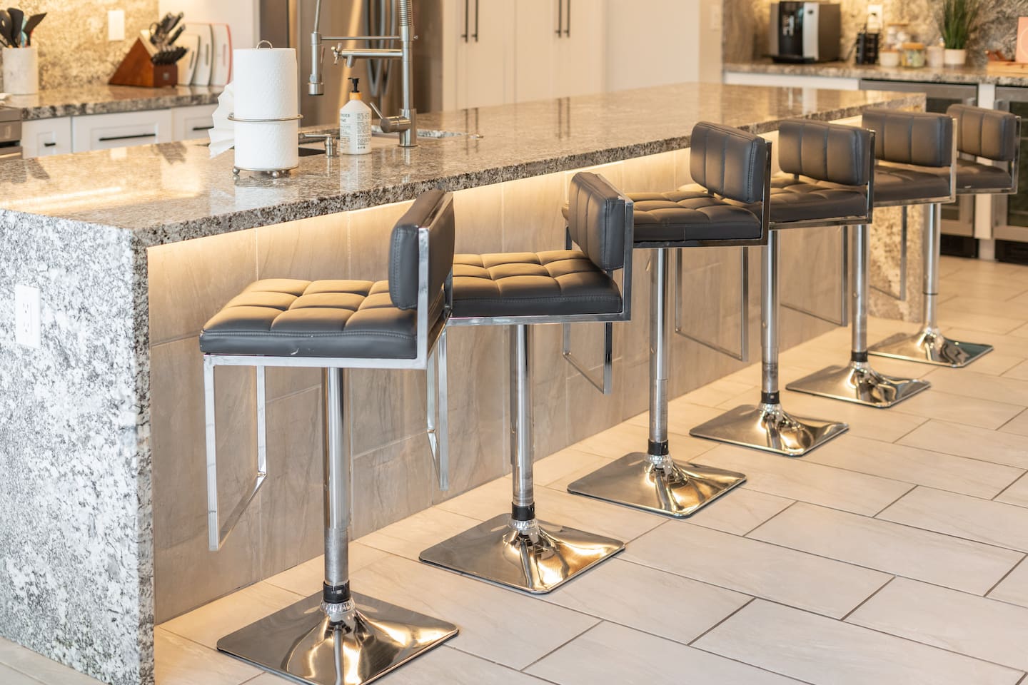 Modern barstools and glowing underlights.

