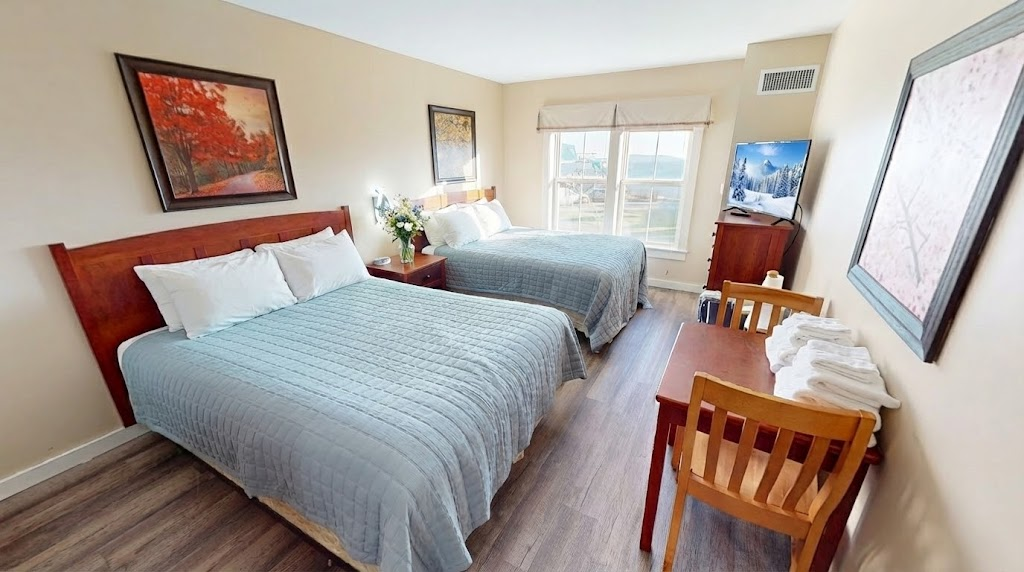 Second bedroom with two comfy beds—great for families or friends.