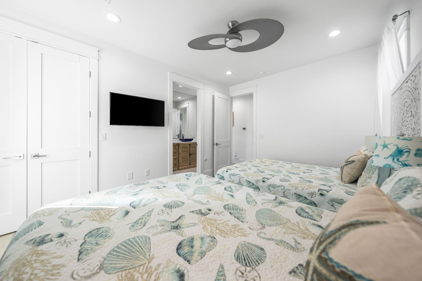 Experience 30A comfort in our second suite!   Two Queen beds (sleeps 4) with comfortable linens, a high-power Supersonic fan, and a Smart TV /  attache to designer bath, it’s the ultimate setup for those  seeking a pristine, AC-cooled retreat.